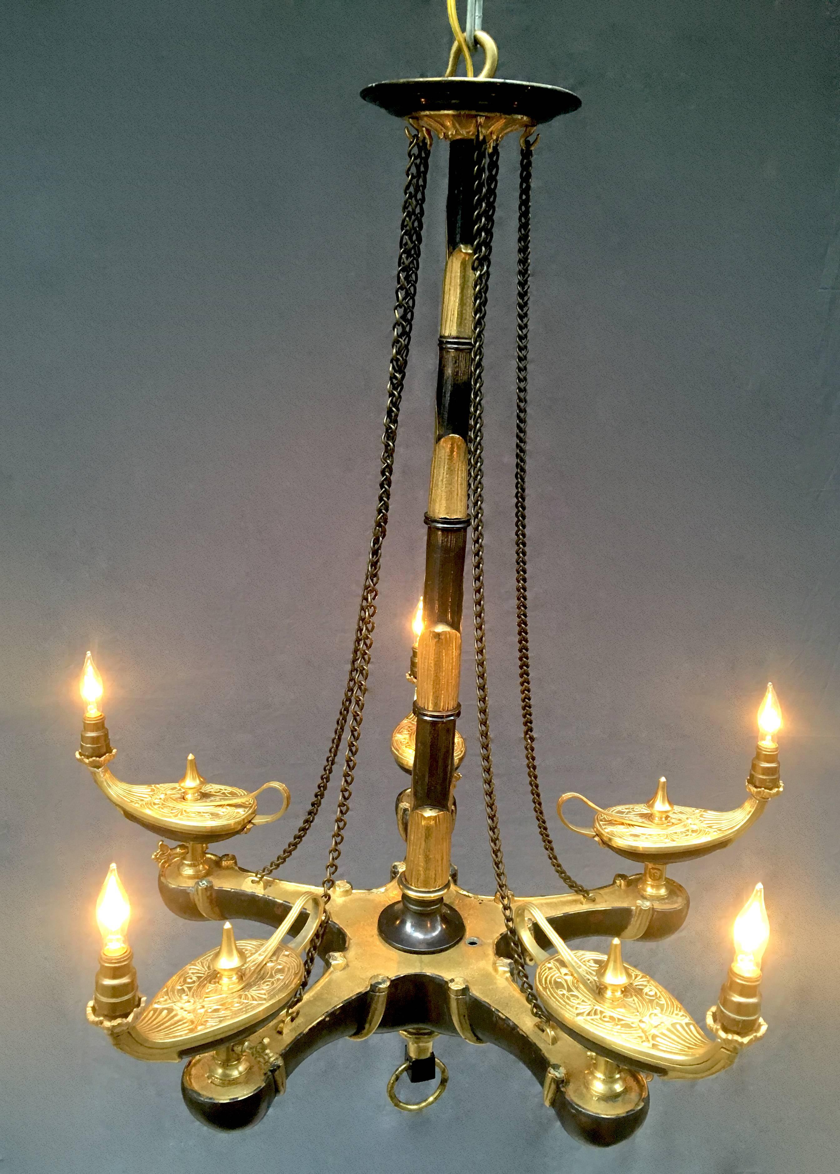 A French chandelier that was originally gas and now features five lights, circa 1840. In the French Moroccan style, it features Aladdin burners from two-tone bronze doré.