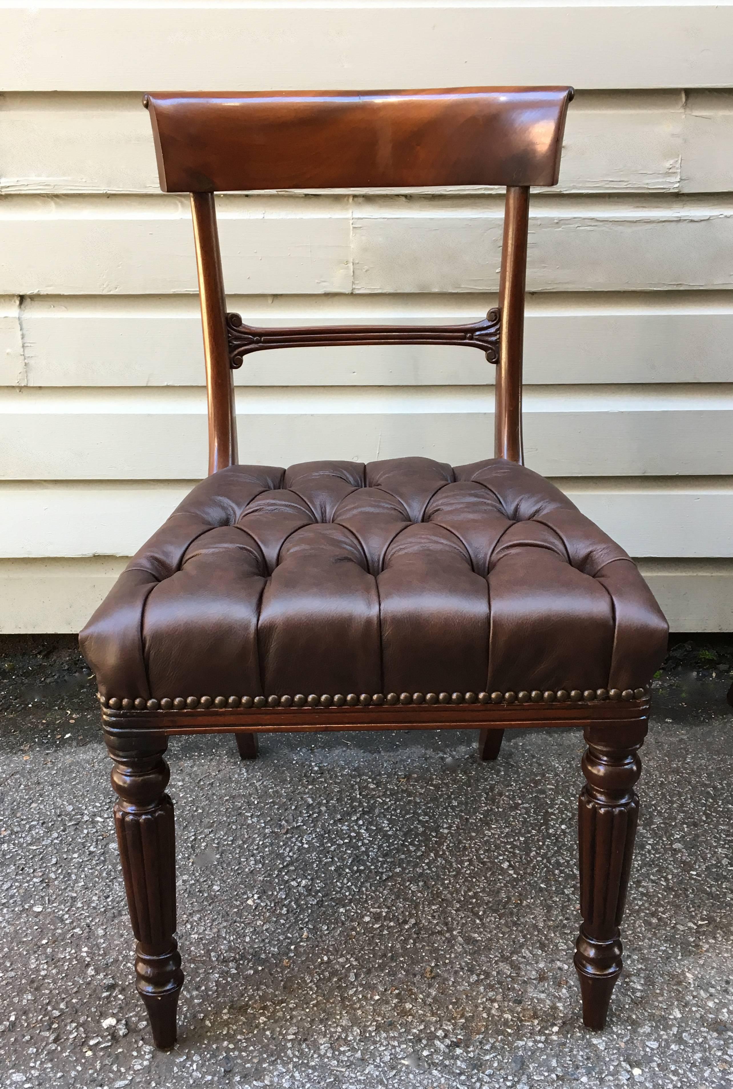 19th Century Philadelphia or Baltimore Neoclassical mahogany and tufted leather chairs. The chairs have beautiful flame mahogany curved backs with reeded center rail and turned legs with stop fluting. 