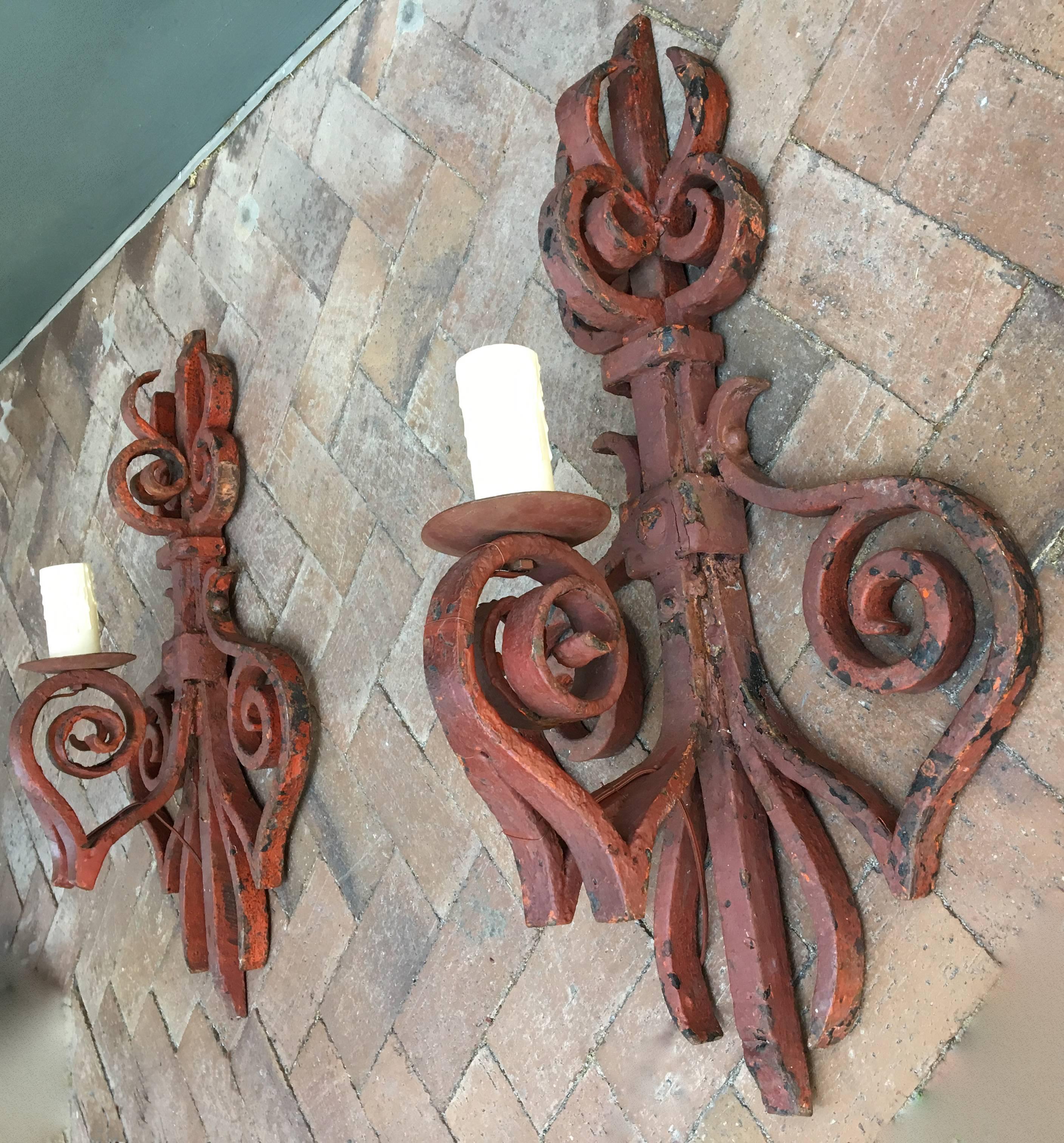 These early 19th century French hand-wrought iron brackets were made into sconces. At 29