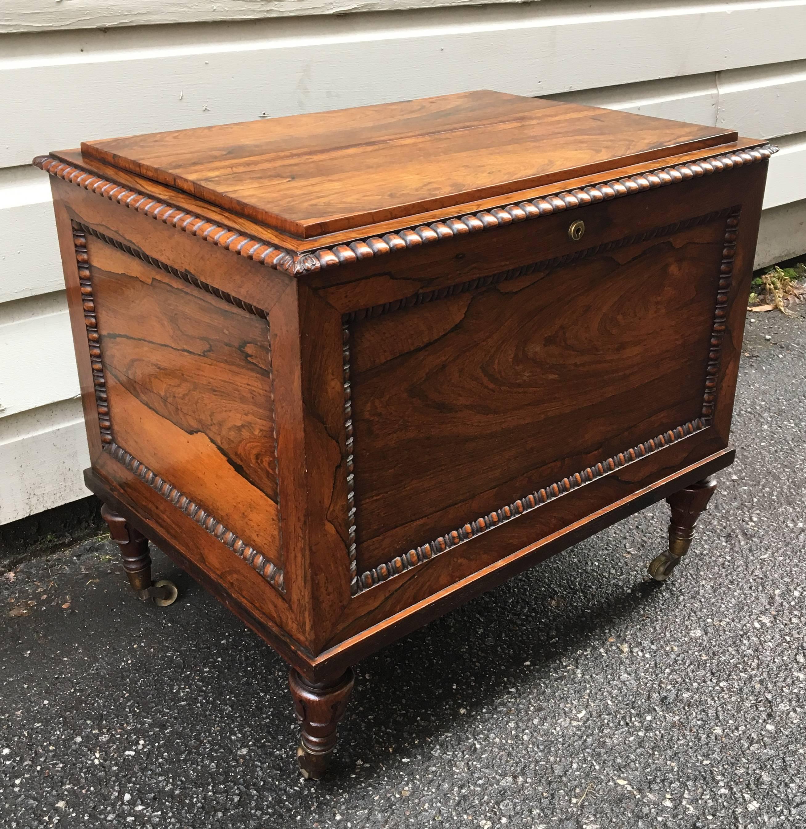 This Early 19th Century English Regency Campaign rosewood canterbury has original casters and original lock. The interior is divided into three equal sections.