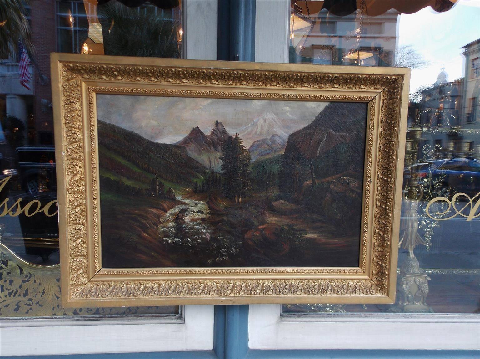 American oil on canvas of landscape depicting mountains, meadows, and a stream in the original mounted foliage gilt frame. Late 19th Century.