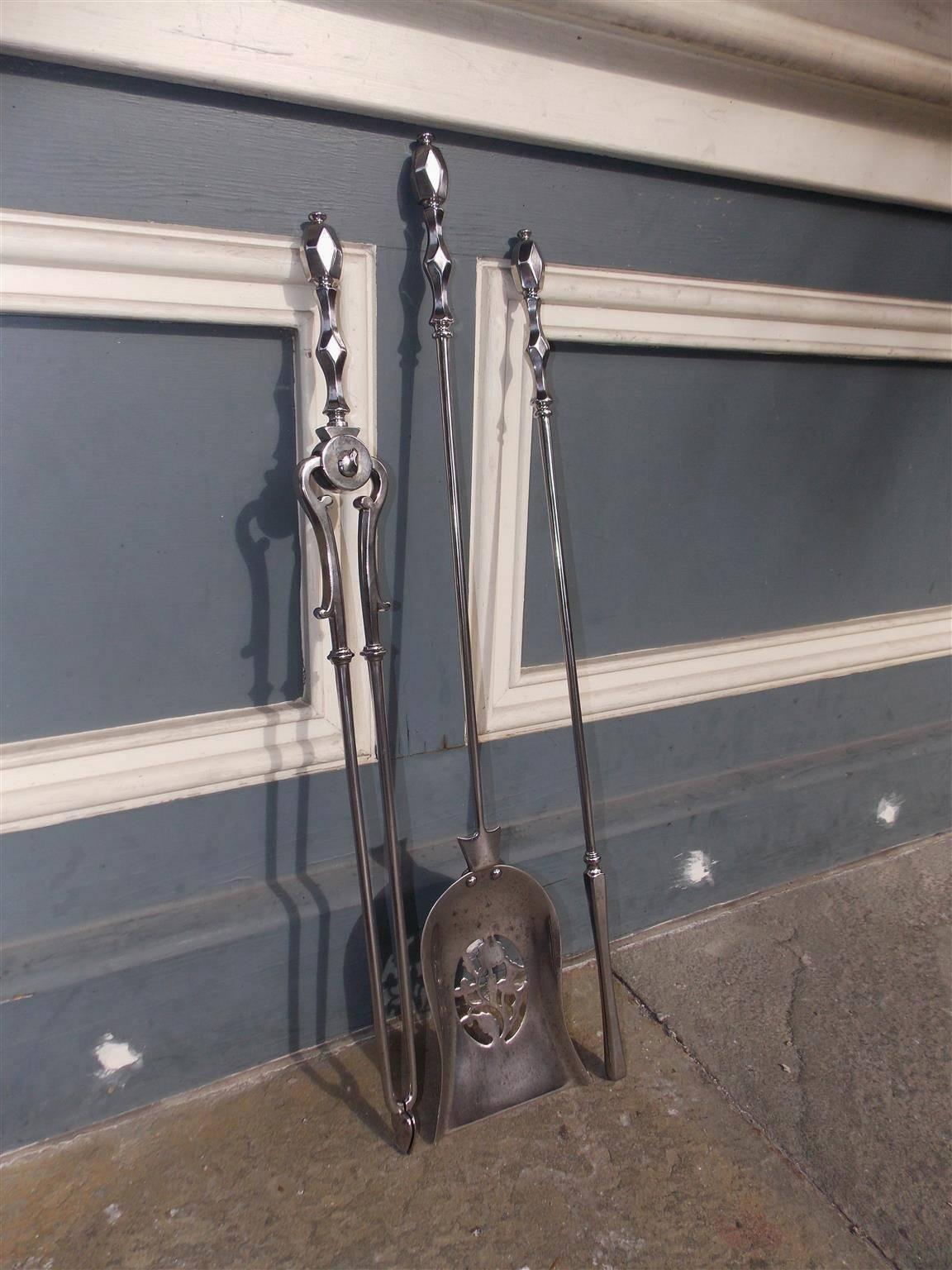 Set of English Regency polished steel fire tools with hand chased faceted diamond handles, turned bulbous ringed columns and a decorative pierced floral shovel. Set consist of shovel, tong and poker, Late 18th century.