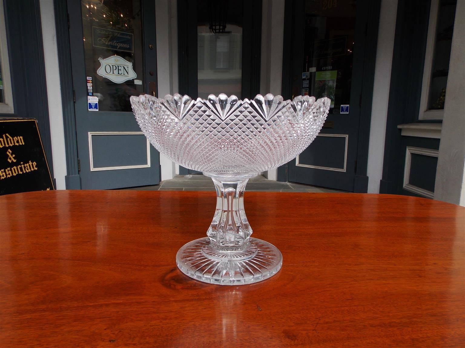 Irish cut crystal compote with floral cut rim, cross hatching, fluted tapered pedestal, resting on circular etched base, Late 18th century. Compote is 7