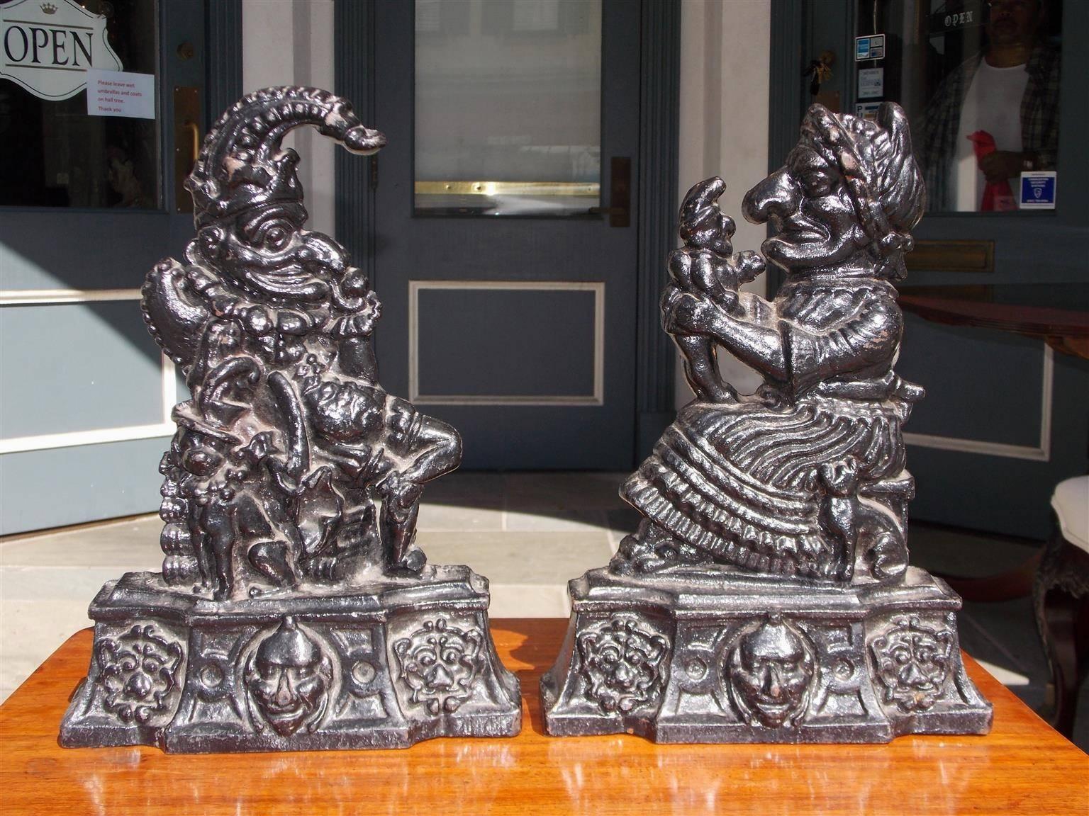 Pair of English large cast iron Punch & Judy matching doorstops . Late 19th century.
