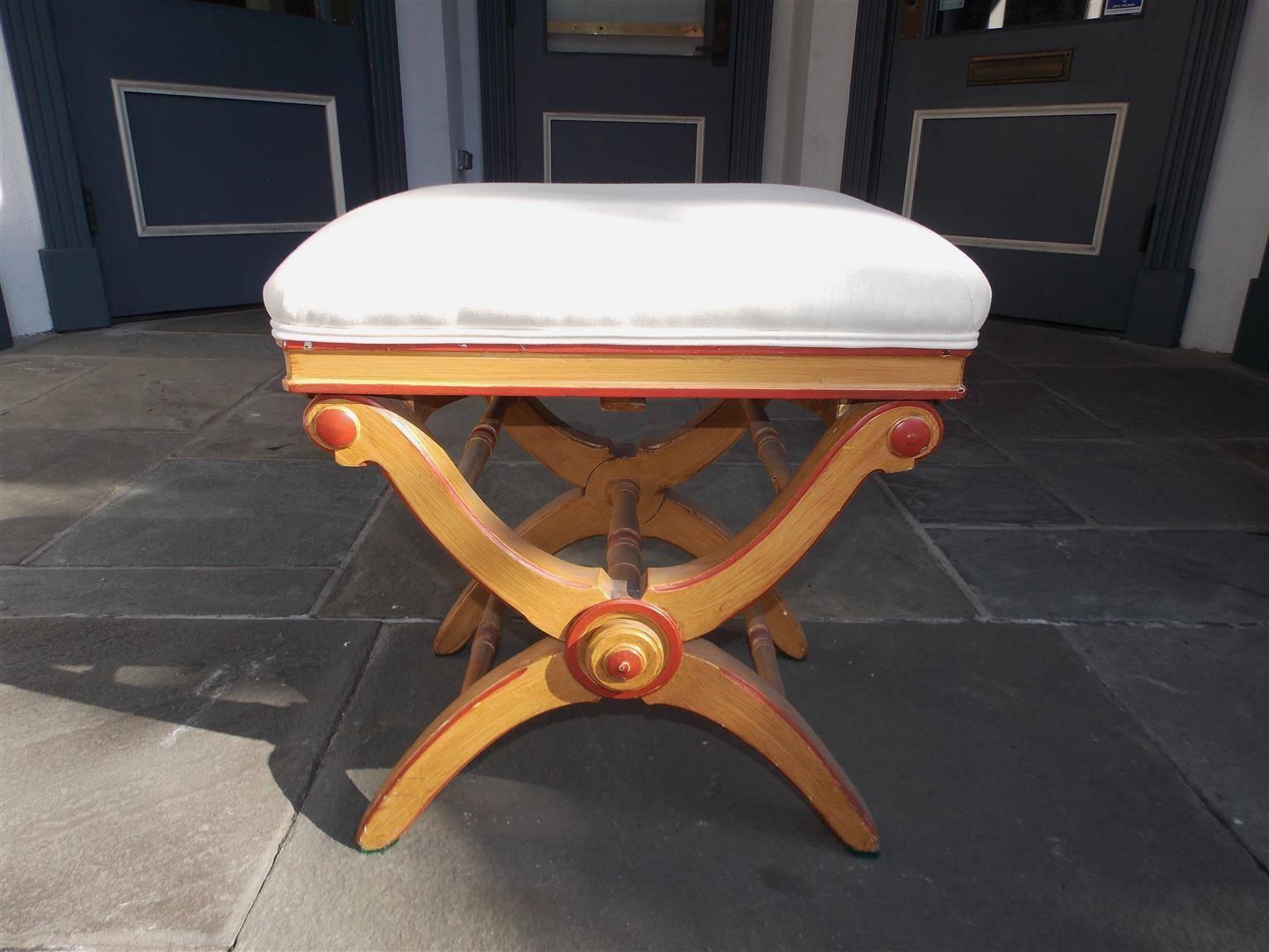English painted and upholstered crule piano bench with adjustable seat and connecting stretchers, Early 19th century.