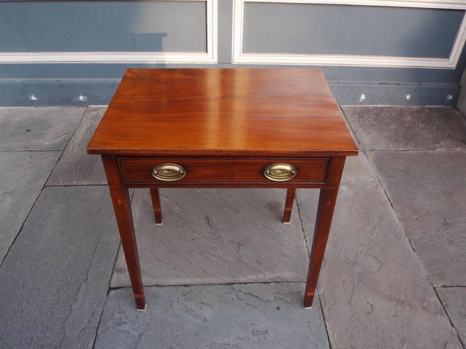 American Charleston mahogany one drawer side table with one board top, cornucopia oval brasses, flanking bell flowers surrounded by holly string inlay, terminating on tapered squared cuffed legs. Secondary wood consists of white pine, Late 18th