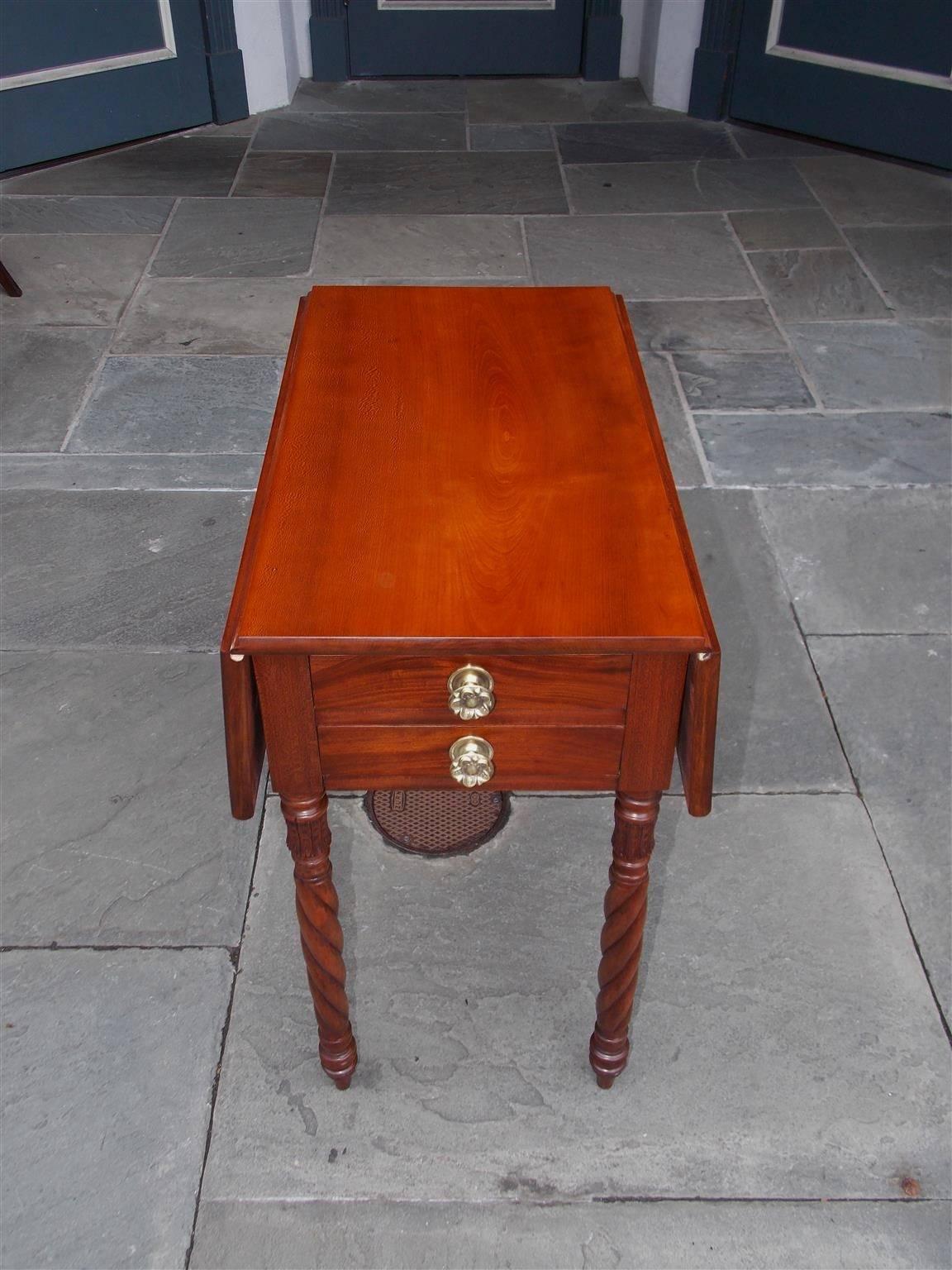 American Federal cherry drop-leaf side table with four drawers, floral brass pulls and terminating on carved floral bulbous barley twist legs. Table is finished on all sides with two pull-out drawers on each end. North Carolina, Early 19th Century.