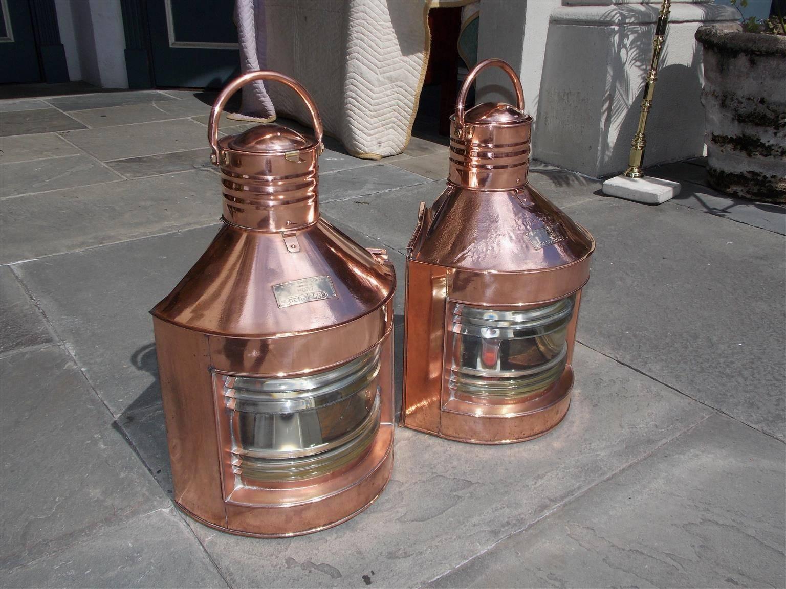 Pair of Anglo-Indian copper and brass port and starboard ship lanterns with the original Fresnel lenses, vented tops, stamped badges, carrying handles and rear sliding doors with handles and mounting brackets. Lanterns have been electrified. Sachin