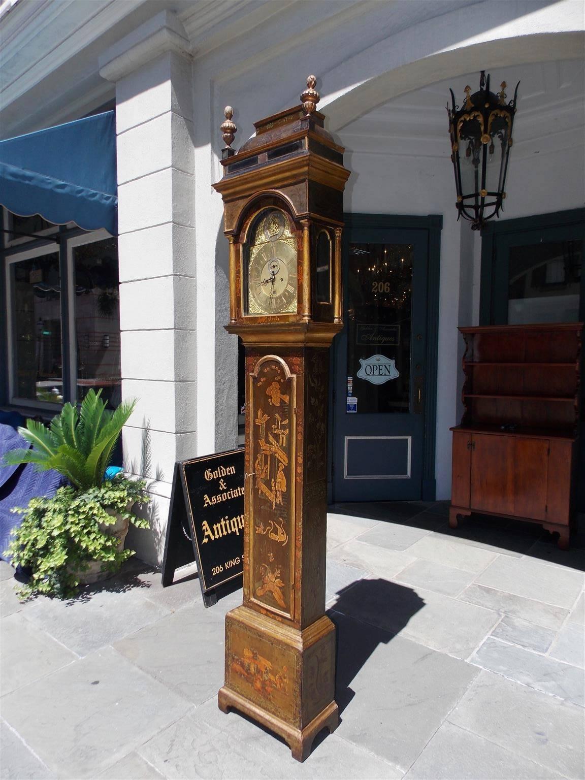 English chinoiserie tall case clock with pagoda glass cornice, flanking gilt carved urn finials, arched hood with a hinged door revealing Venus and ormolu engraved face, decorative figural landscape trunk, original interior weights and pendulum,