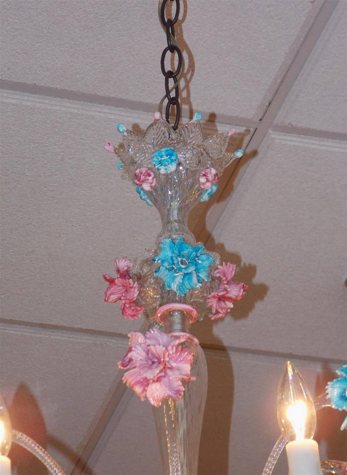 Venetian hand blown Opaline Murano six-light chandelier with vibrant pink and blue floral colors, crown canopy, centered bulbous column, scrolled arms with the original crown bobeches, and finished with a decorative vibrant floral lower pendant.