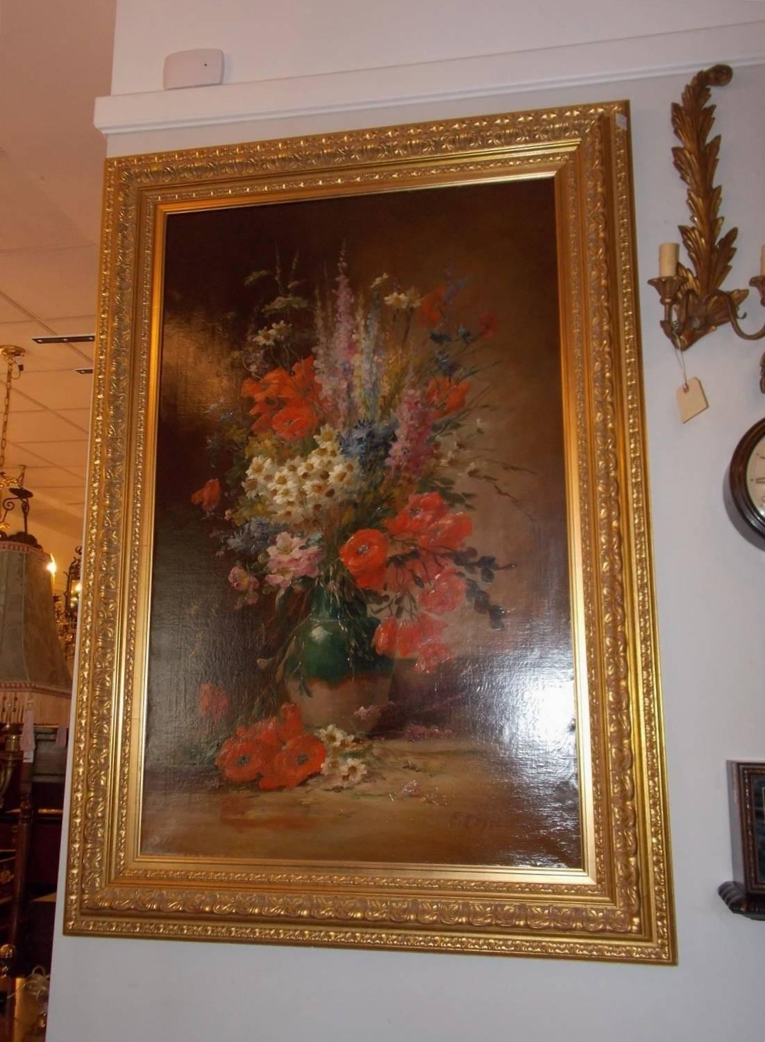 A very fine and rare oil on canvas still life of Summer flowers in the original gilt carved floral frame. Signed lower right corner Edmund Van Coppenolle, Belgium, 1846-1914.