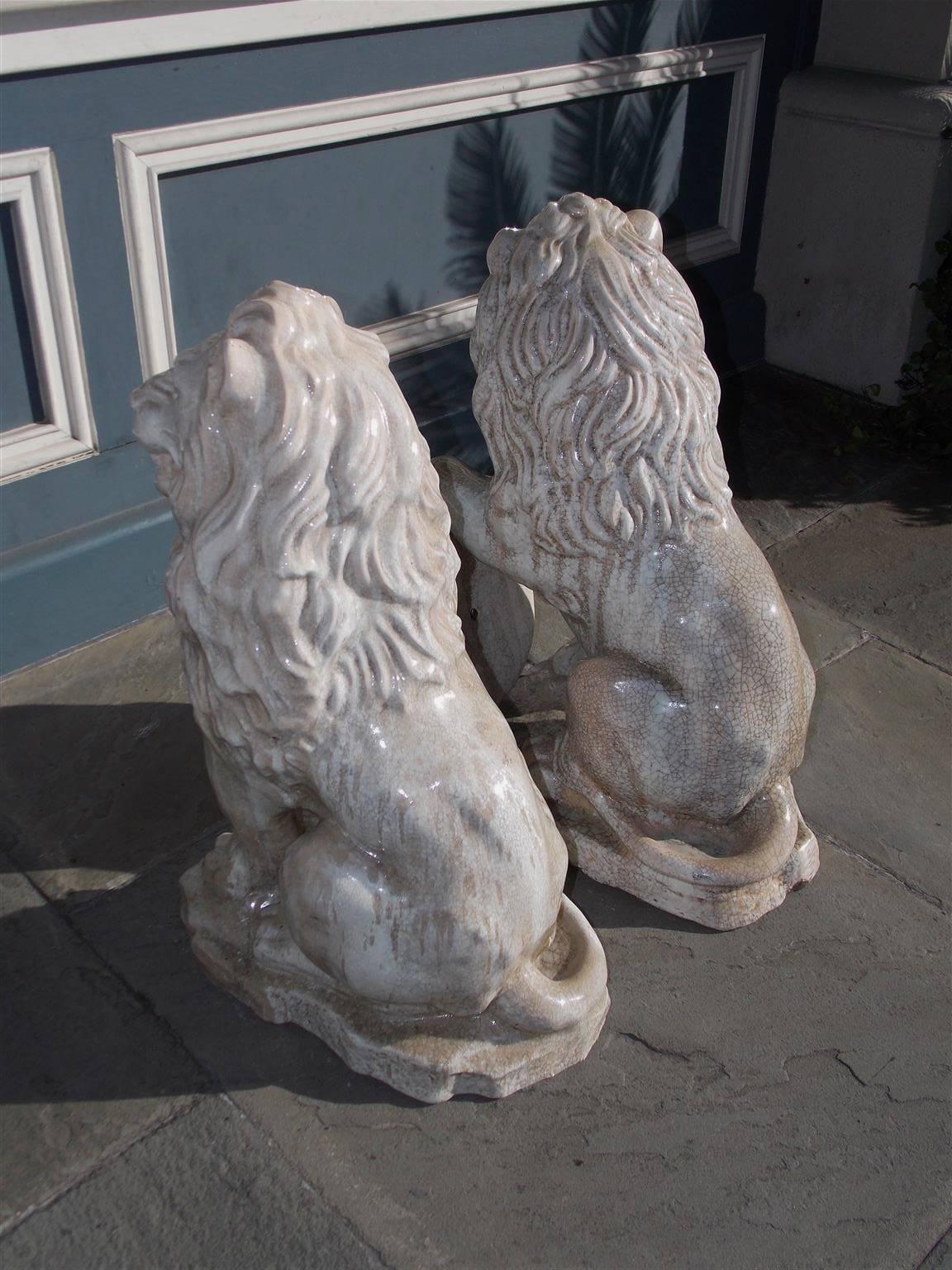 Pair of French Glazed Terracotta Lions Grasping Fleur De Lis Plaques, Circa 1840 1