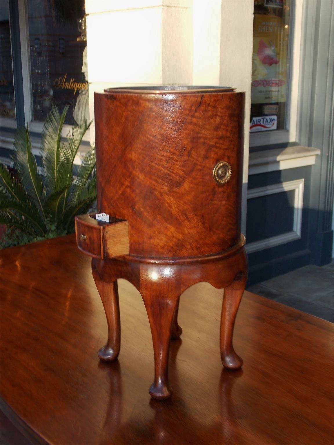 English Queen Anne burl walnut diminutive one drawer cellarette with a fitted lead and copper lined interior,  original side handles , carved molded scalloped skirt, and terminating on the original pad feet. Mid 18th Century  