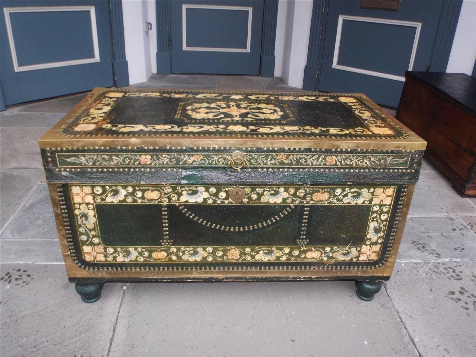 Chinese Campaign camphor wood hinged nautical chest covered in hand painted floral leather with brass studs, mounts, side handles, and terminating on the original bulbous painted bun feet, Early 19th century.