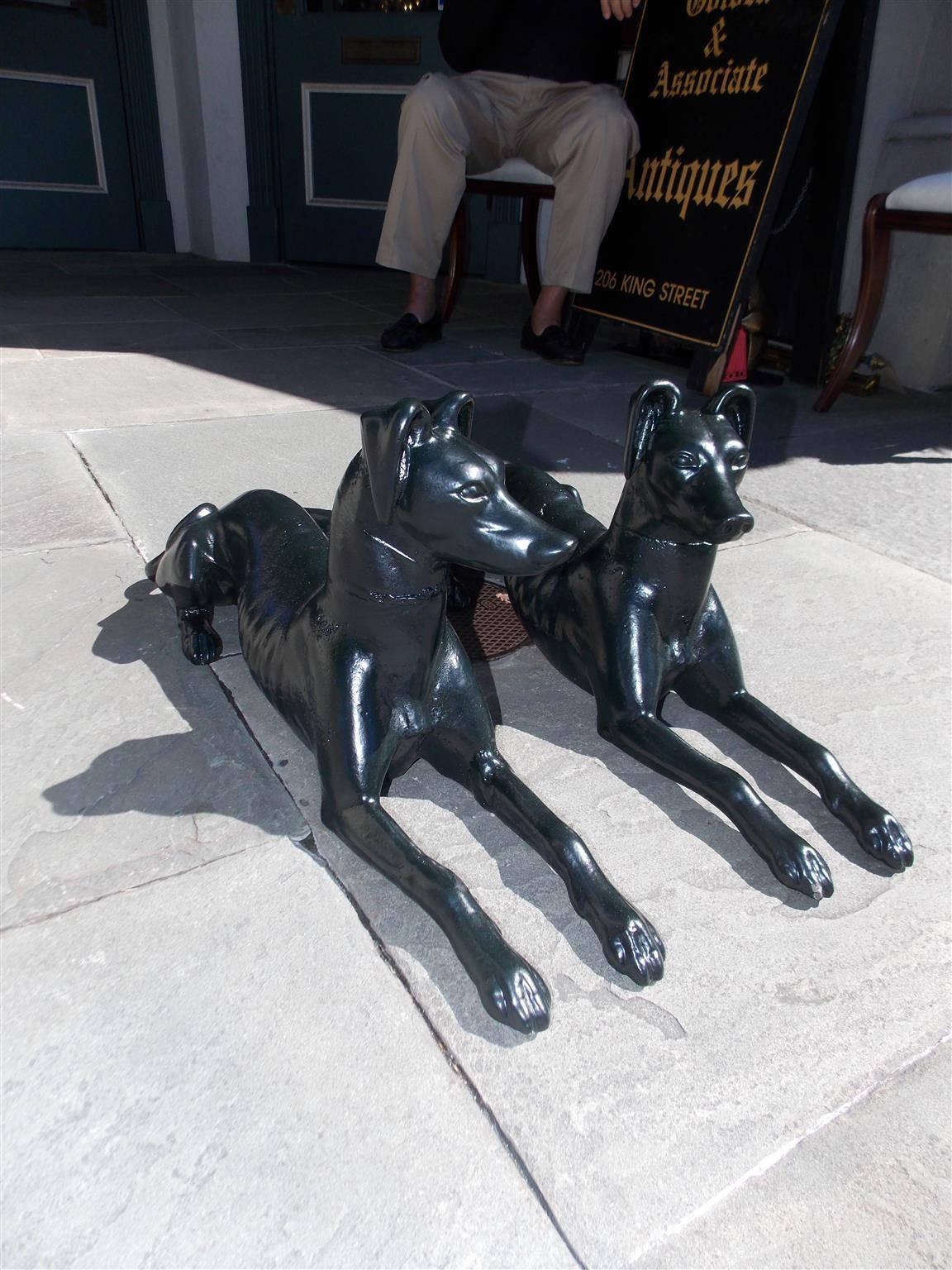 Pair of English diminutive solid cast iron whippets laying in resting position. Pair have been powder coated in the color of Charleston green , Early 19th century.