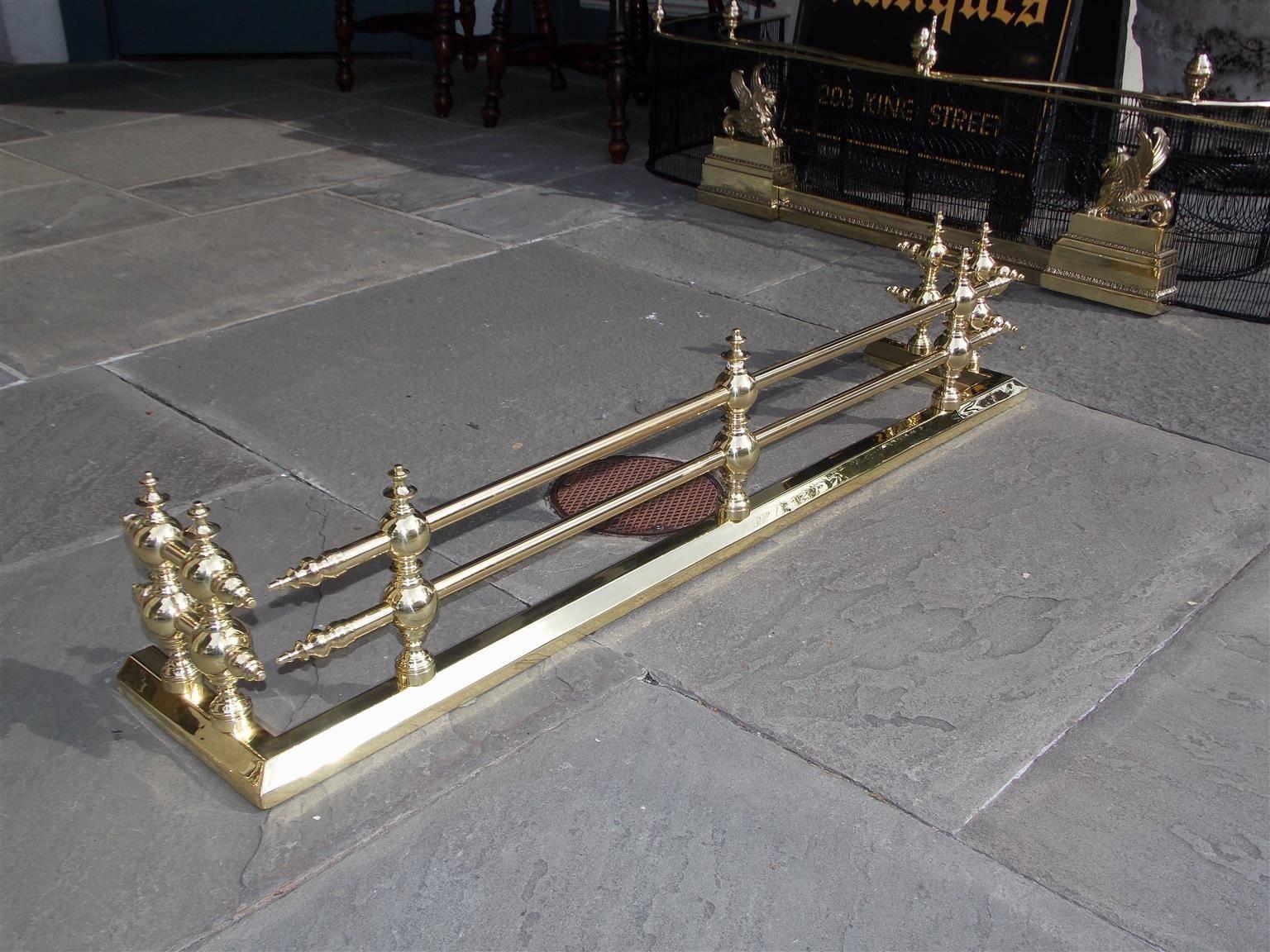 American brass two tiered bar fire fender with bulbous ball finials and rectangular molded base. Mid 19th Century