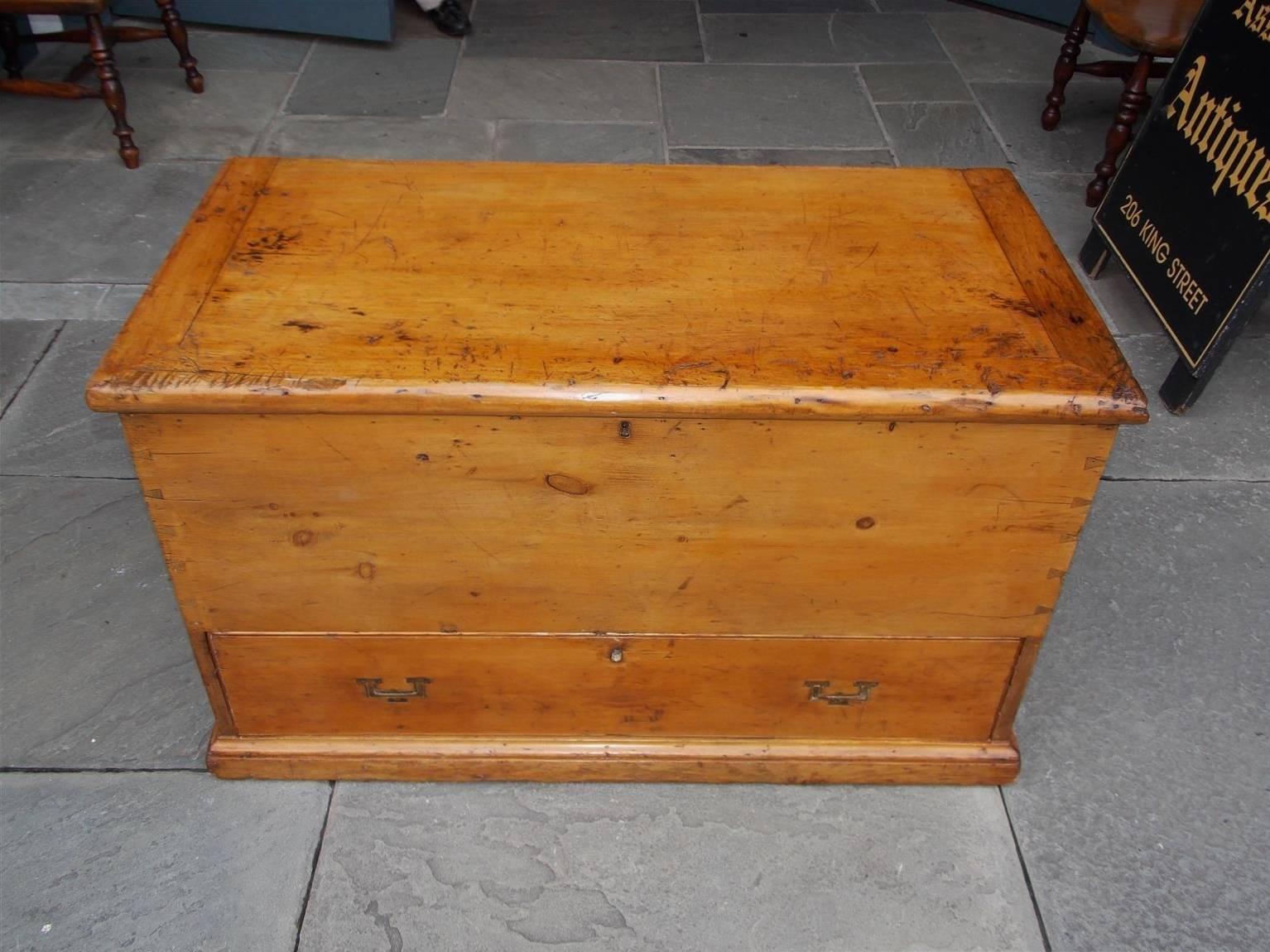 American white pine sailor's nautical traveling chest with upper hinged top, exposed dovetailing, fitted interior compartment revealing till and two hidden drawers, single exterior lower case drawer, original recessed brasses with wrought iron side