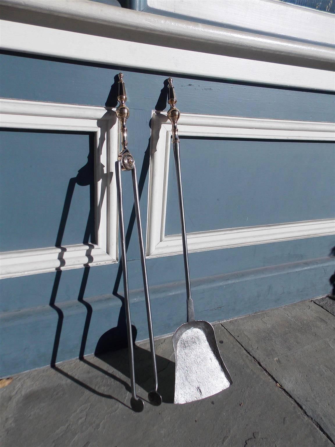 Pair of American brass and polished fire tools with ball chased banded finials and faceted steeple tops. Set consist of tong and shovel. Early 19th century.