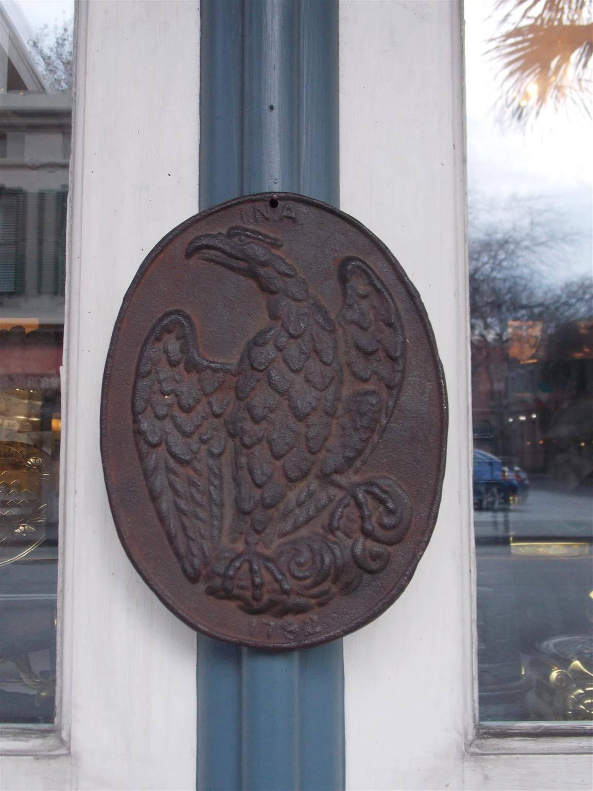 American oval cast iron INA perched eagle fire mark Stamped , 1792. On November 19, 1792 John Nesbitt and Ebenezer Hazard met in Philadelphia's Independence Hall to create the Insurance Company of America.  INA wrote the first policy to cover ships,