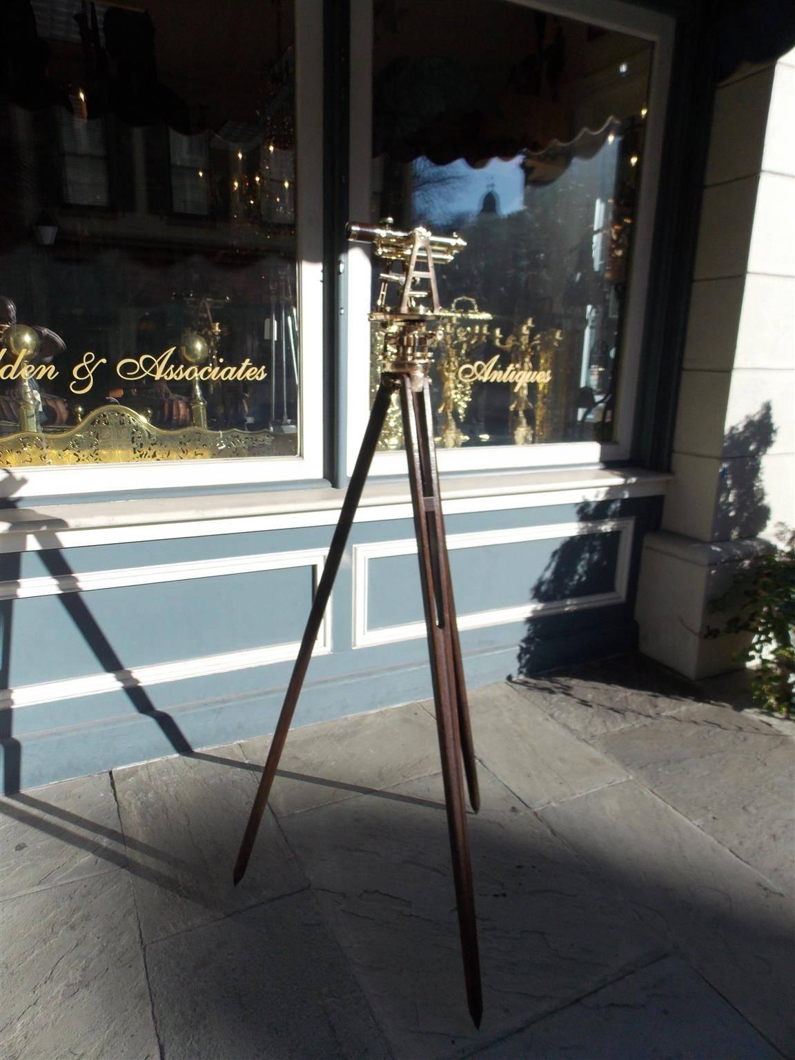 American brass surveying transit on oak tripod stand. F. E. Brandis, Sons & Co., was in business during the period 1890-1916, they described this instrument as an engineers' transit with level attachment, gradienter and vertical arc, Late 19th