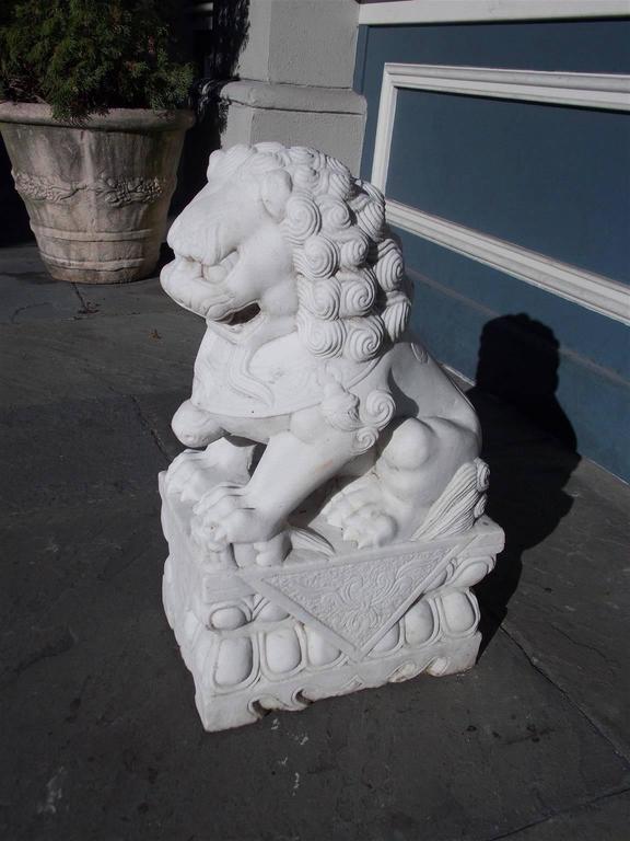 Chinese Marble Foo Dog Resting on Squared Decorative Plinth, 20th