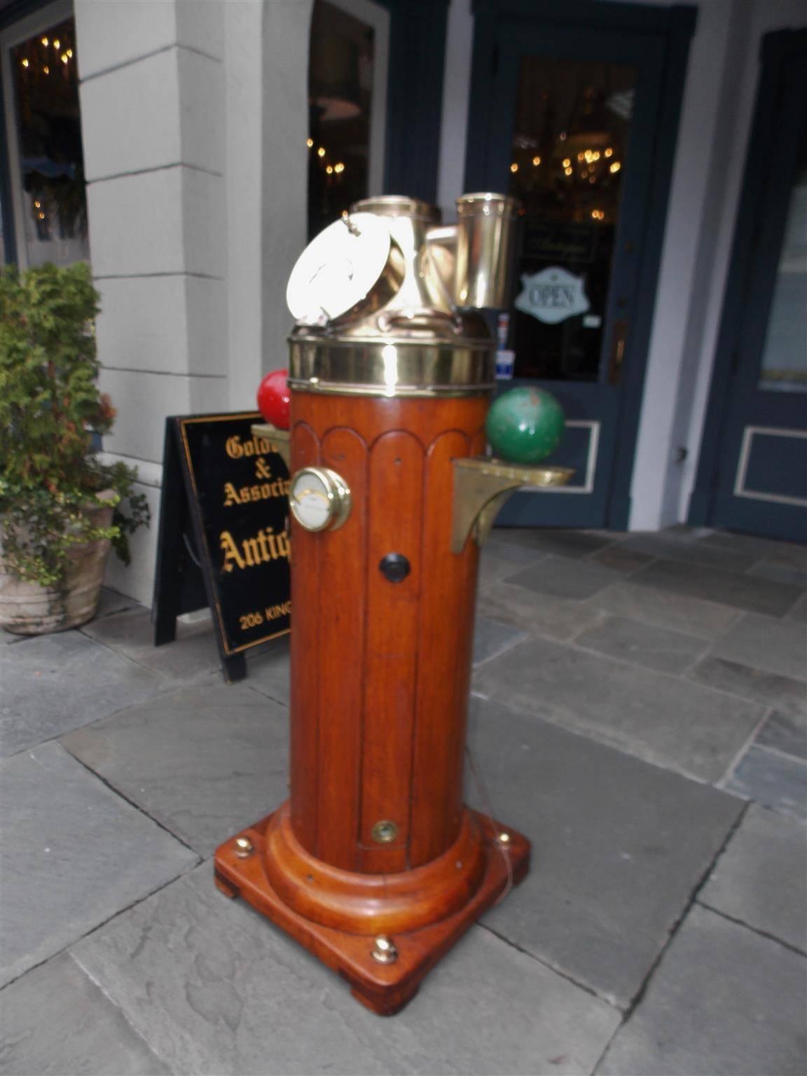 Henry Browne & Son Ltd. was established in the 19th Century in Barking London. This highly desirable and Fine maritime instrument is made of carved mahogany and brass with a helmet style compass cover and flindler's tube with a CAP. It was deck