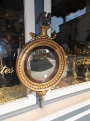 English Gilt Convex Mirror with Ebonized Perched Eagle, Circa 1810