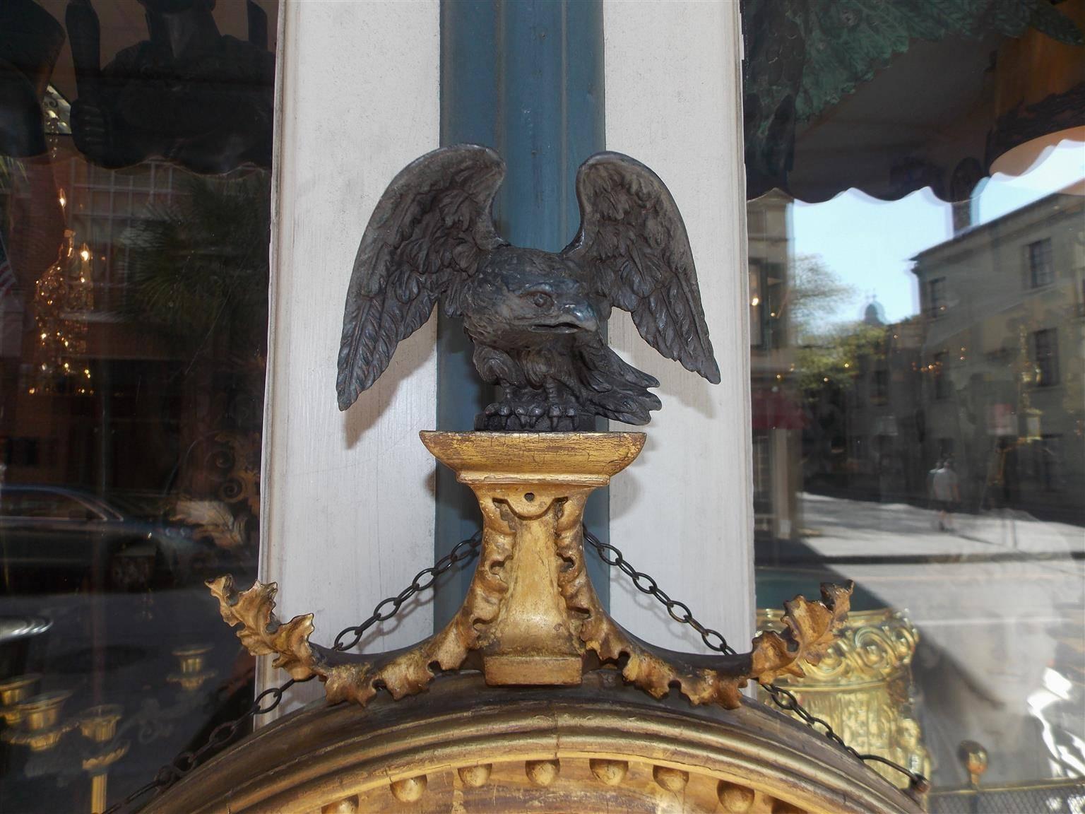 George III English Gilt Convex Mirror with Ebonized Perched Eagle, Circa 1810 For Sale