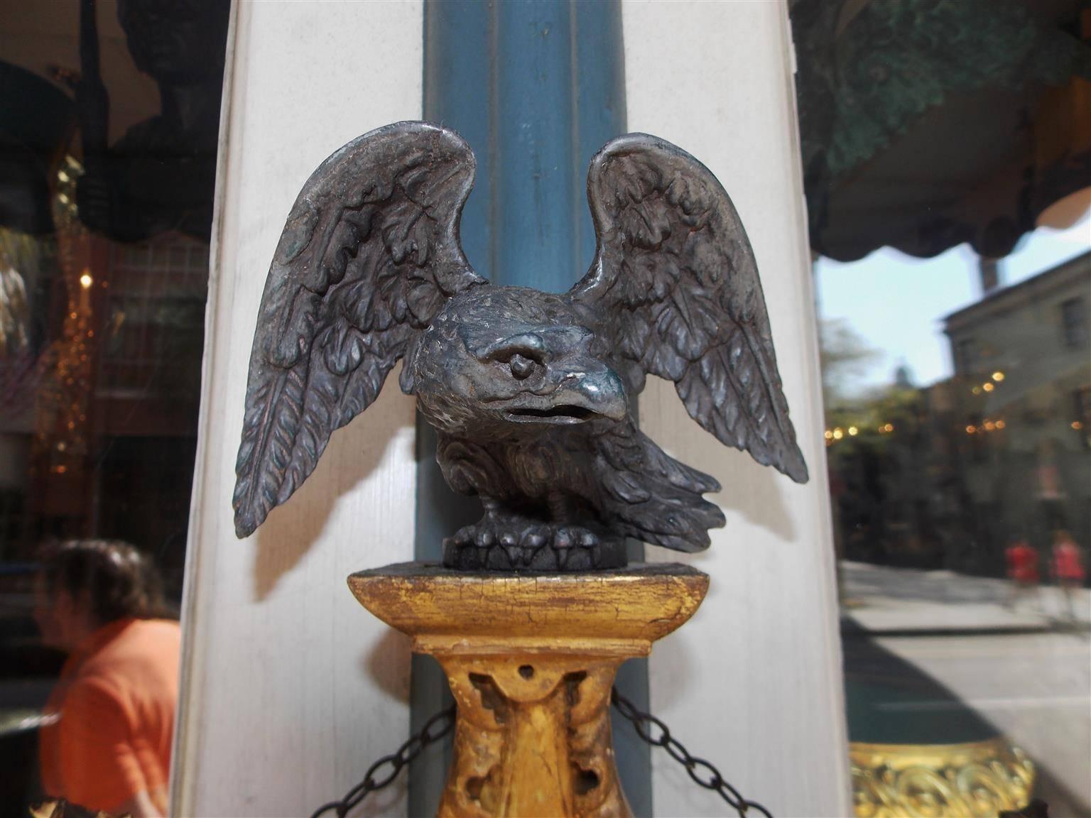 Early 19th Century English Gilt Convex Mirror with Ebonized Perched Eagle, Circa 1810 For Sale