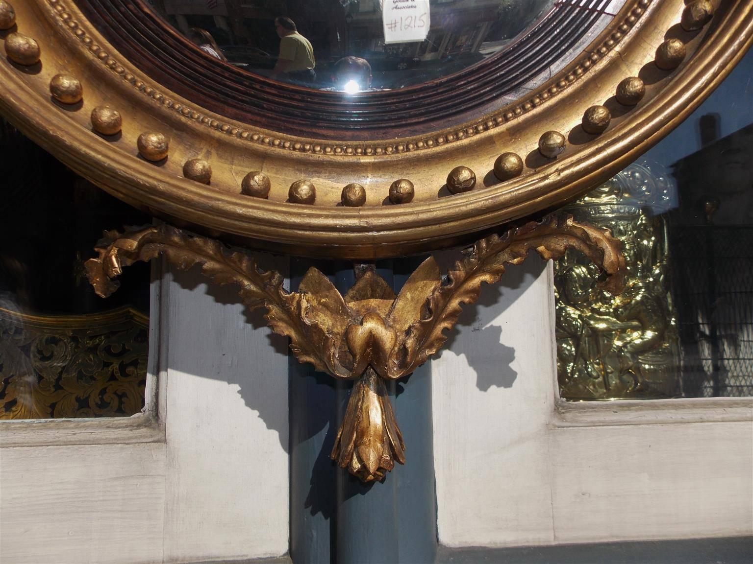 Glass English Gilt Convex Mirror with Ebonized Perched Eagle, Circa 1810 For Sale