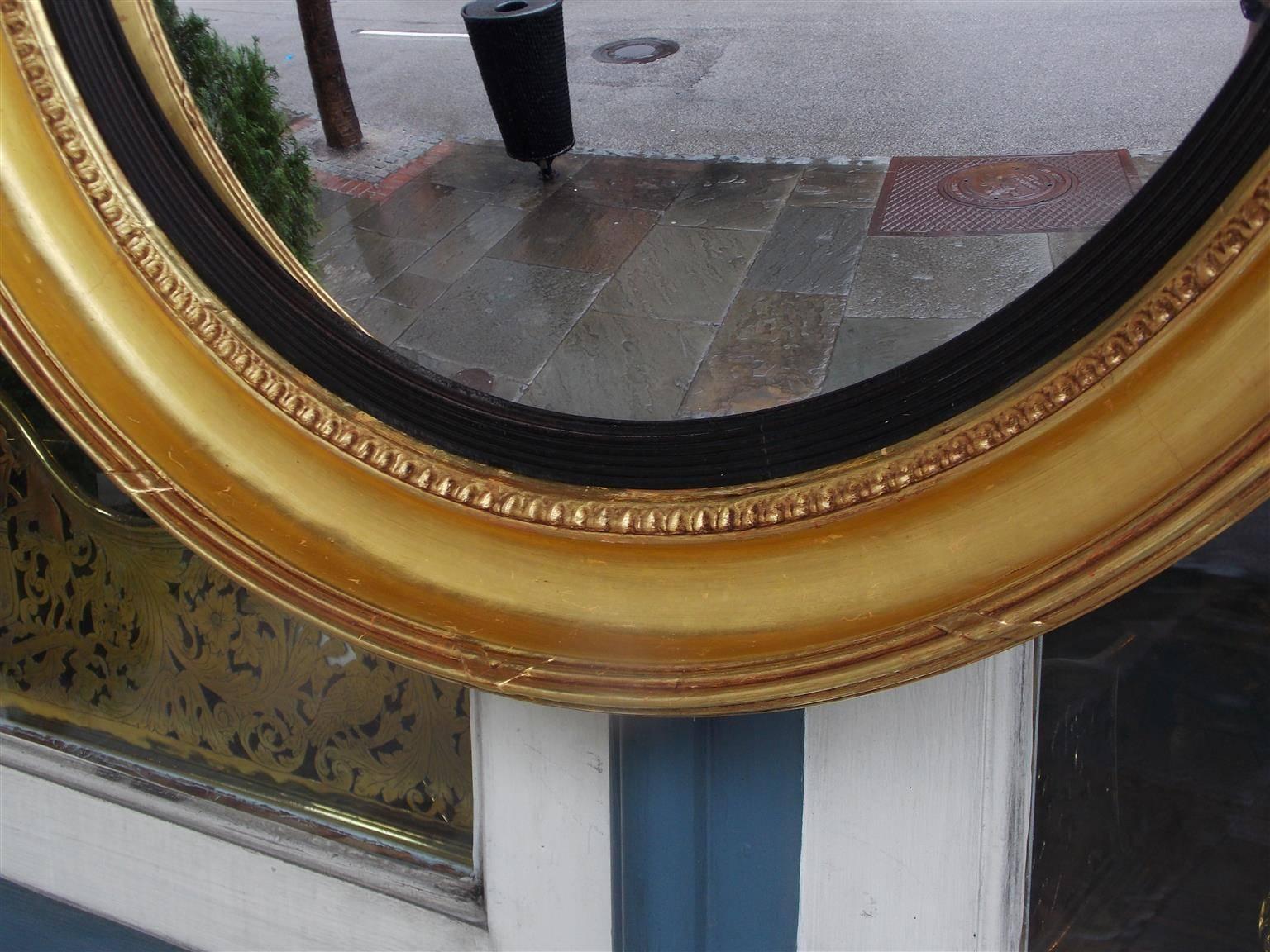 Early 19th Century American Federal Gilt Acanthus Convex Mirror with Perched Eagle, Circa 1810