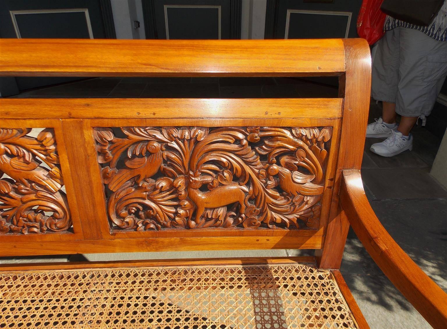 Caribbean Kings Wood Carved Foliage and Animal Cane Settee, Circa 1830 In Excellent Condition In Charleston, SC