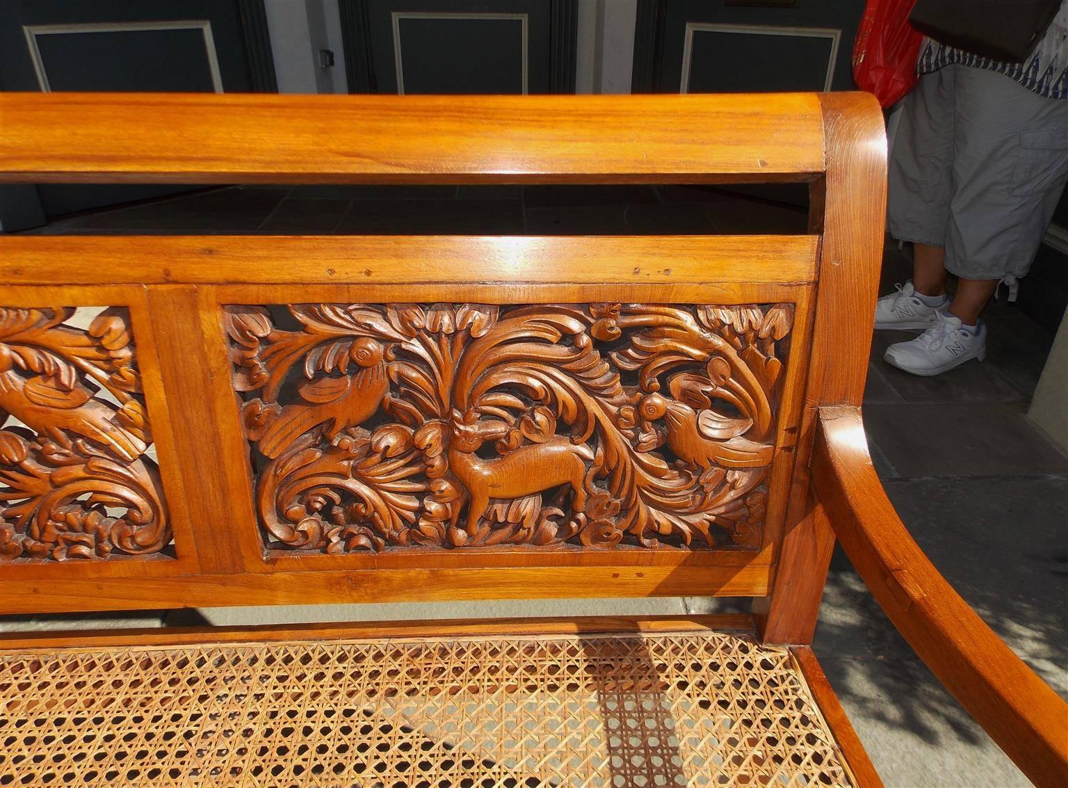 Caribbean Kings Wood Carved Foliage and Animal Cane Settee, Circa 1830 In Excellent Condition In Hollywood, SC