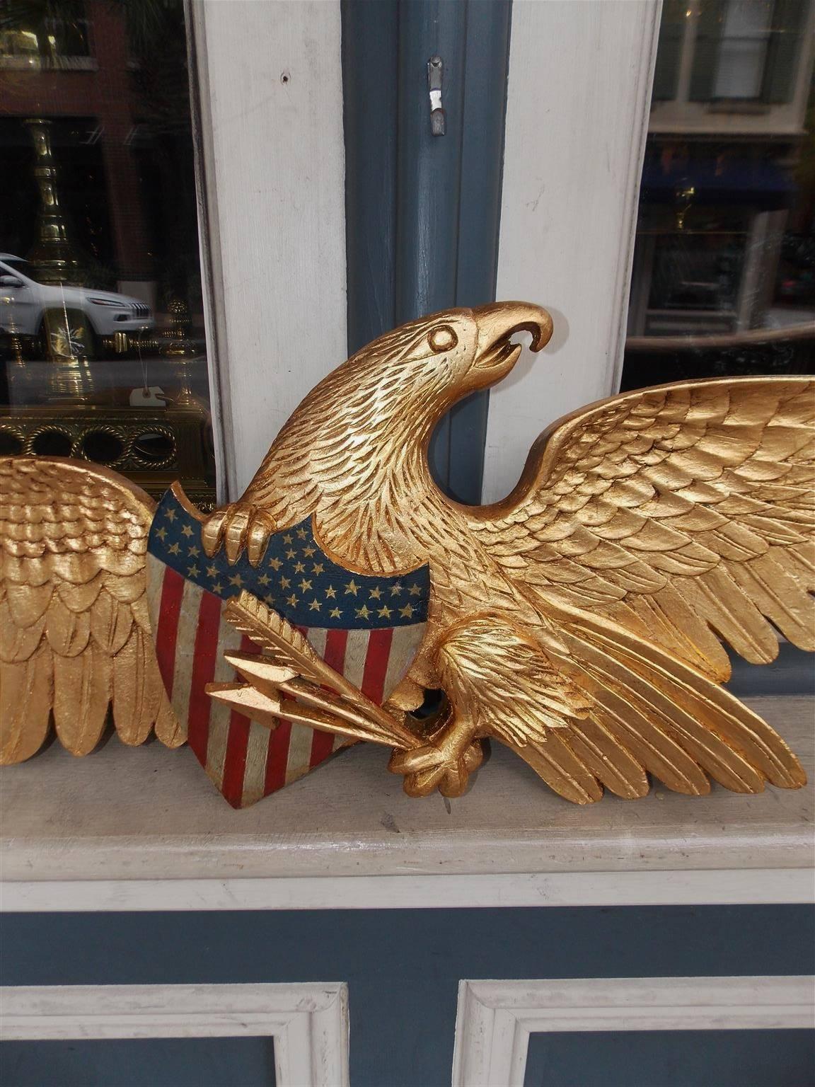 Mid-19th Century American Gilt Spread Wing Eagle Grasping Patriotic Painted Shield, Circa 1850
