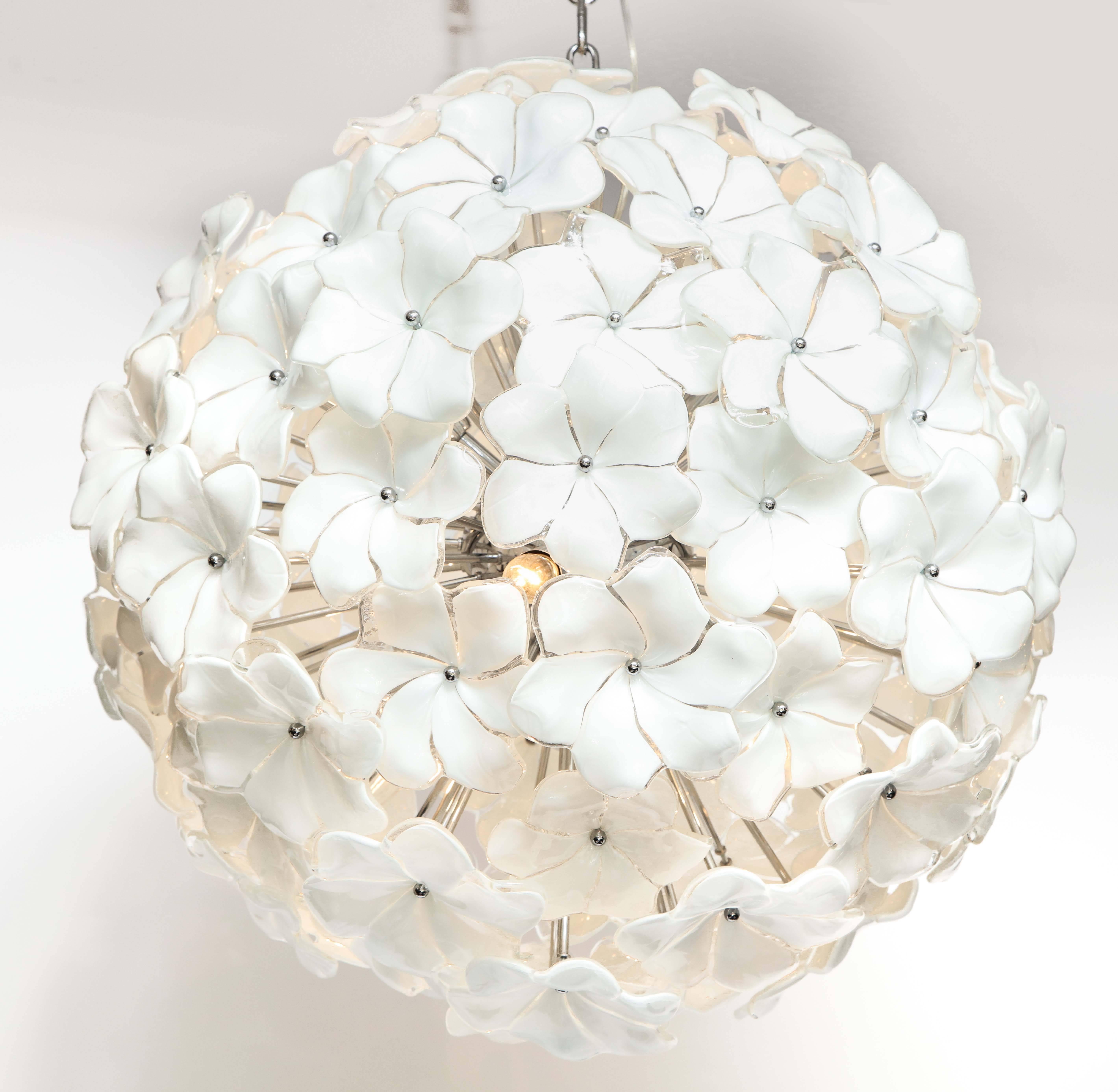 Absolutely beautiful and exquisite in detail. White Murano glass floral sputnik or globe chandelier with individually handcrafted glass petals surrounding a chrome pistil. Polished chrome chain and canopy. Wired for U.S. use with six interior