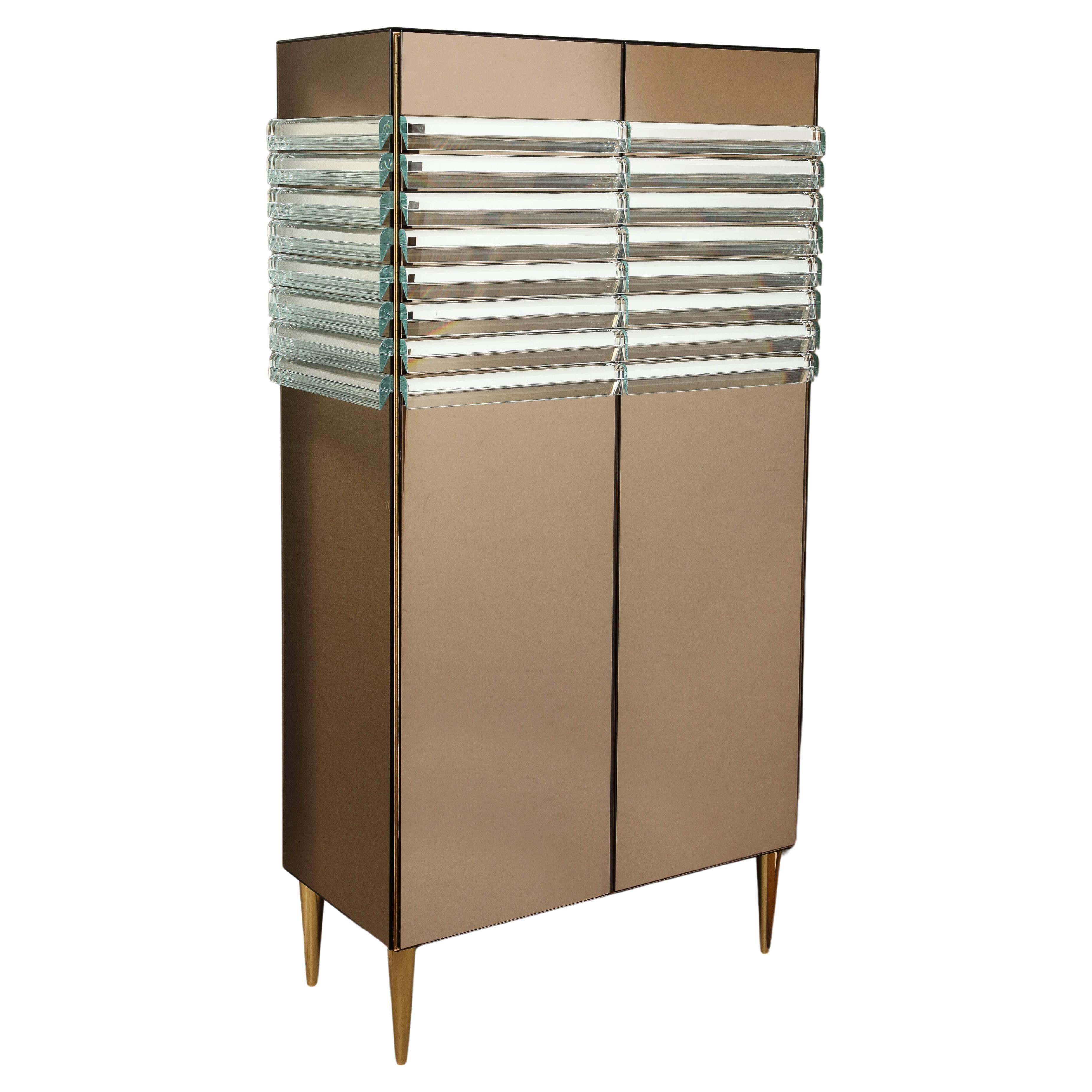 One-of-a-kind Crystal and Bronze Mirrored Tall Cabinet or Dry Bar with Brass Legs, Italy. This piece is versatile and can be used as a cabinet, wardrobe or dry bar. Hand-crafted, wooden, 2-door cabinet is clad or overlayed with bronze tinted
