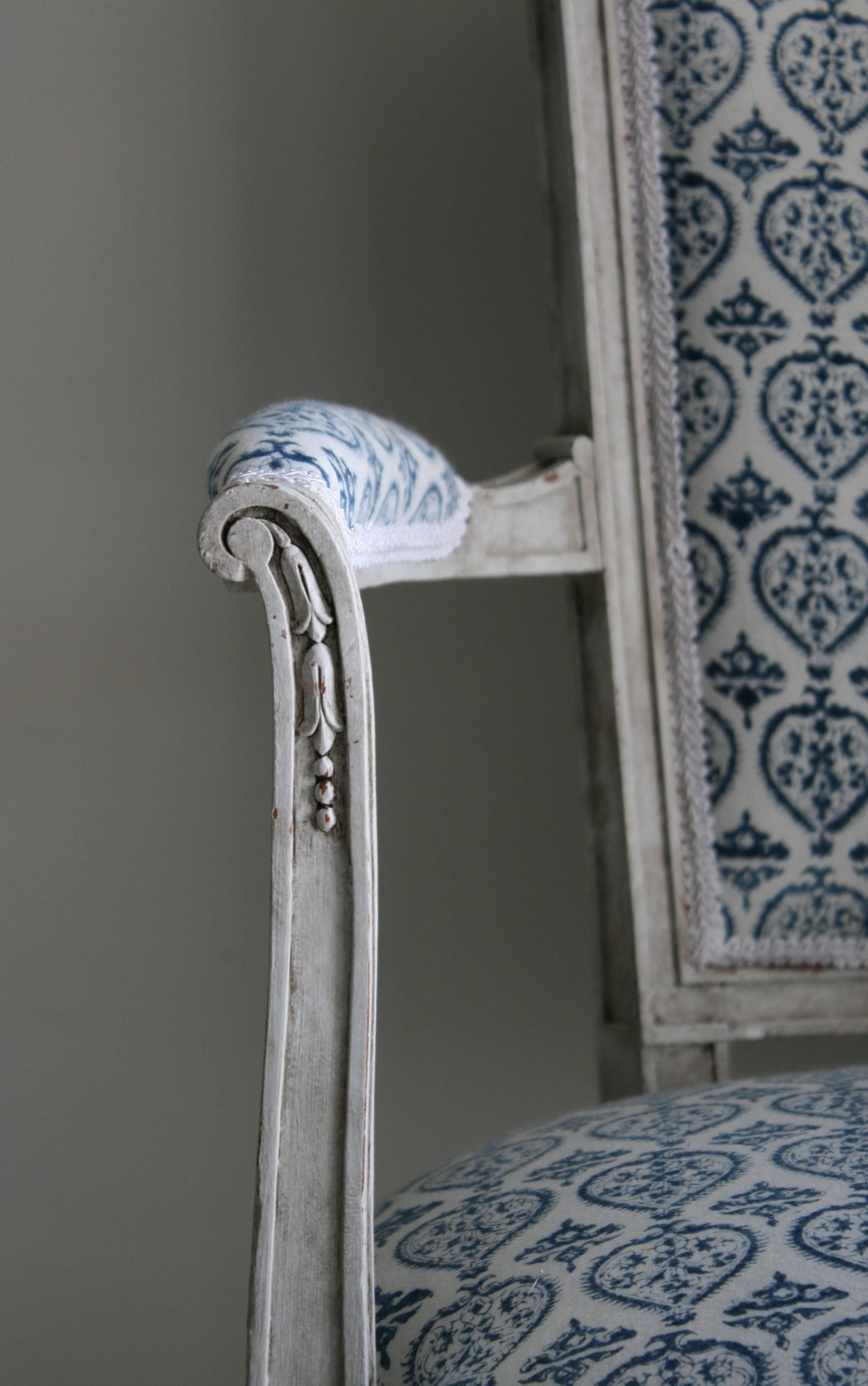 This antique chair is a little gem. Newly upholstered in an organic hand, block-printed French-Indian cotton fabric (indigo against soft white) from Les Indiennes. The antique frame was painted in a soft Swedish grey, with an aged finish that gives