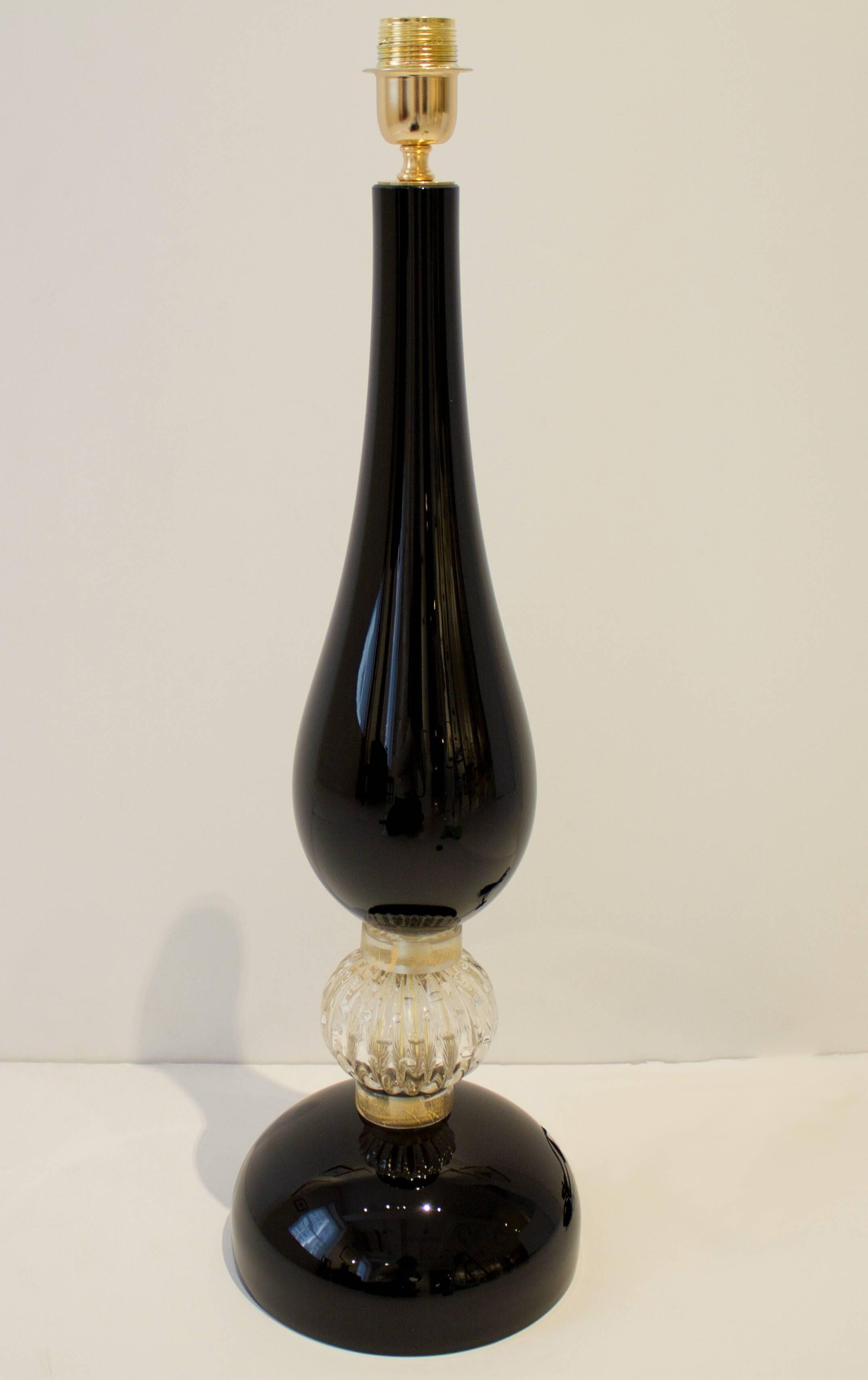 This pair of modern Italian lamps consist of hand blown Murano black glass base with 24-karat infused gold 
