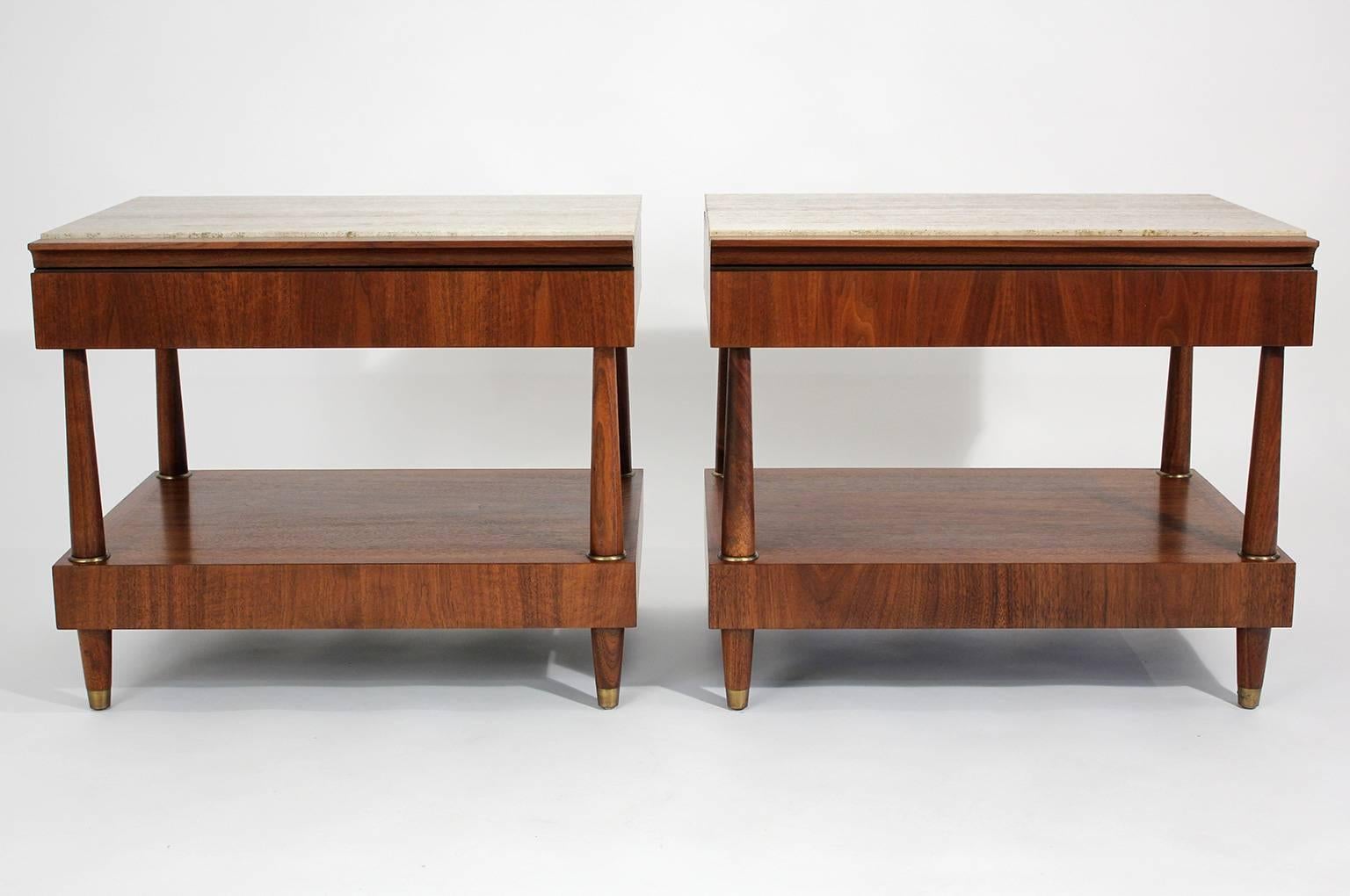 Pair of end tables or night stands with beautiful wood grain, travertine tops and brass accents designed by Bert England for Johnson Furniture, circa 1950s. Restored.