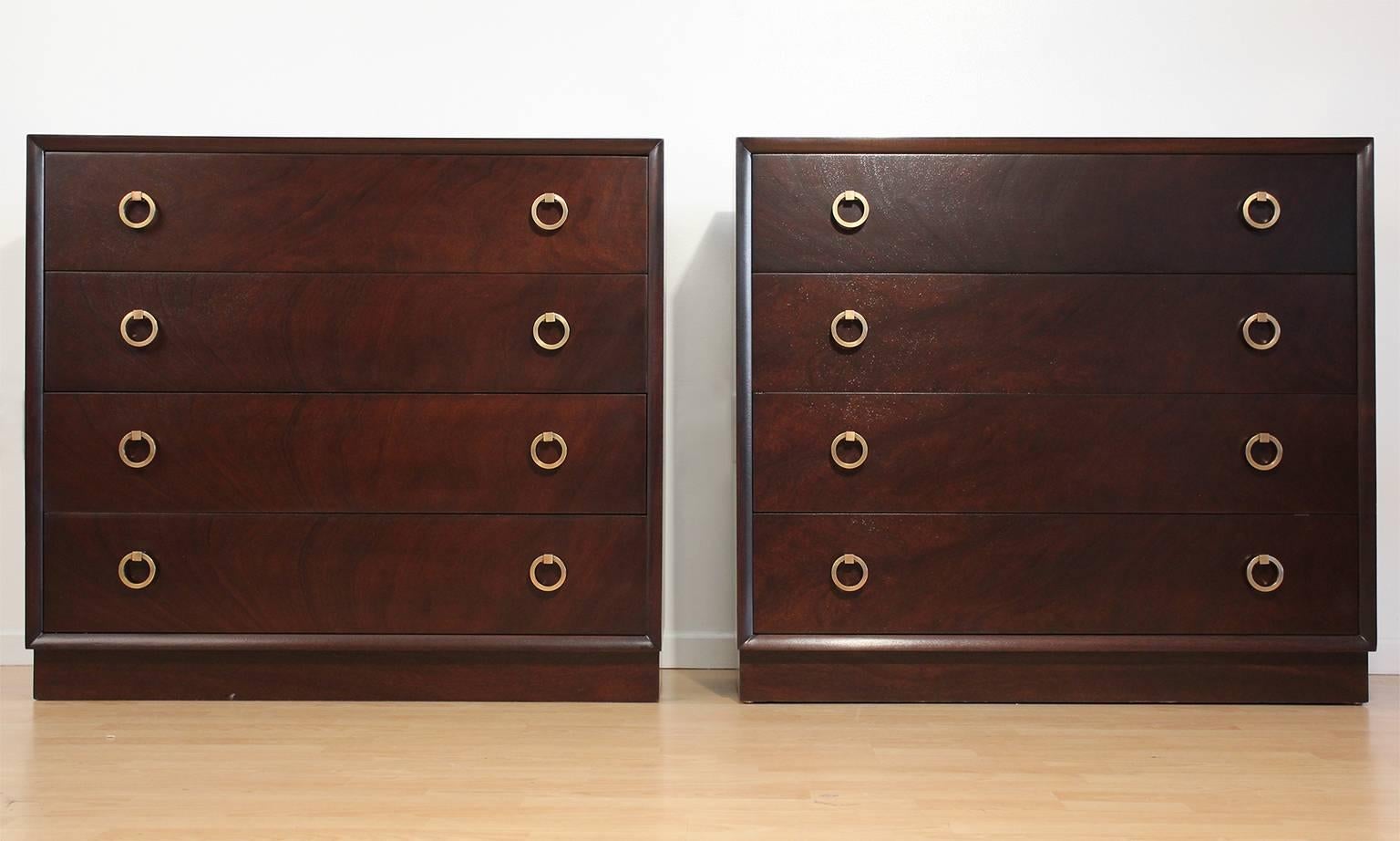 Pair of thin profile 4-drawer dressers or cabinets designed by T.H. Robsjohn-Gibbings for Widdicomb. These would also work well as oversized night stands. Please contact if you only need one cabinet. Restored.