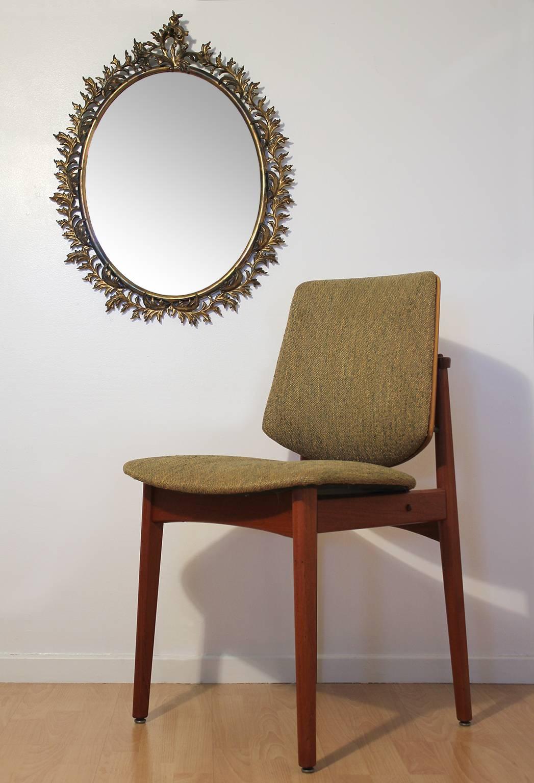 Beautiful antique French Baroque bronze oval mirror. Decorative wreath around the edge. In excellent original condition with a wonderful patina.