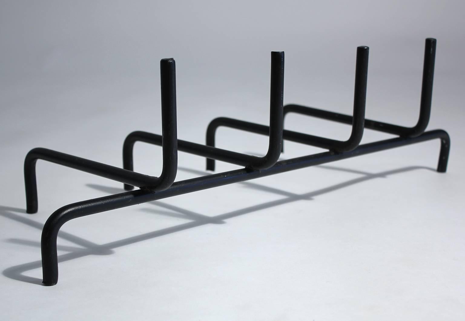 Vintage modern wrought iron fire grate or log holder of simple design and medium scale. Original paint in good condition.