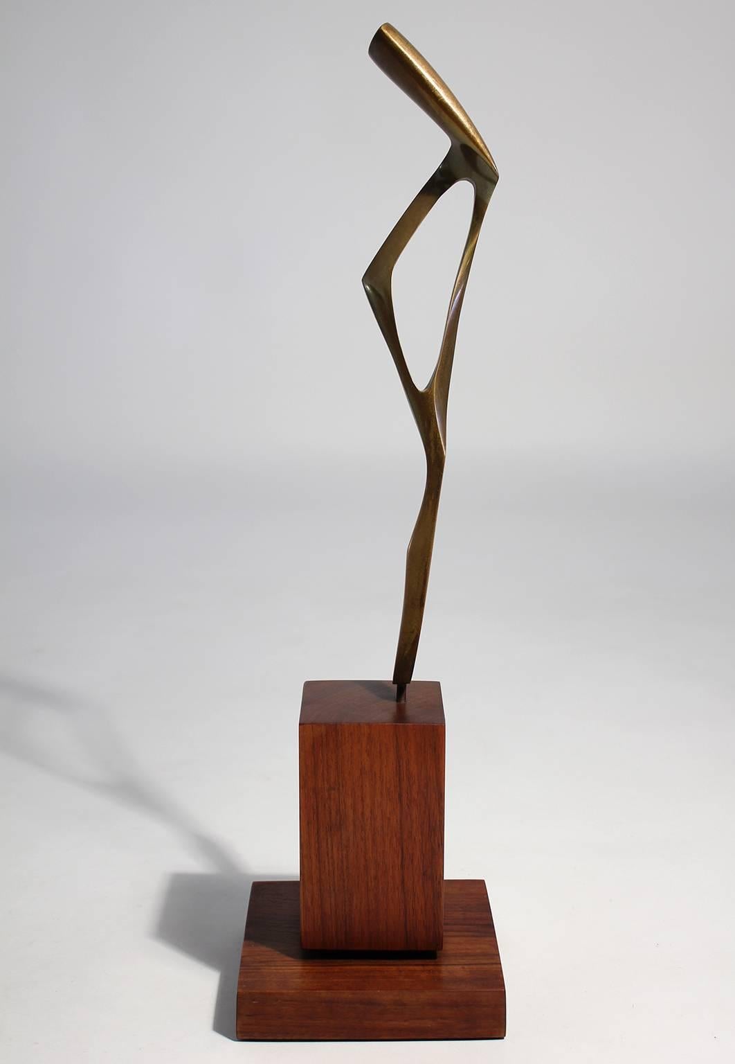 Interesting abstract tall bronze sculpture on double walnut base signed 