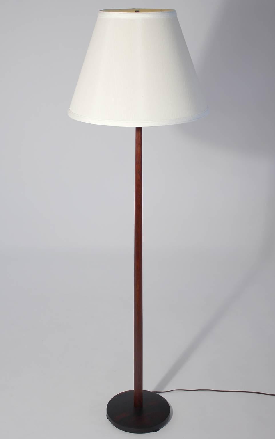 Vintage modernist rosewood floor lamp with weighted base made in Sweden, circa 1960s. Measures: Overall height of 58.5