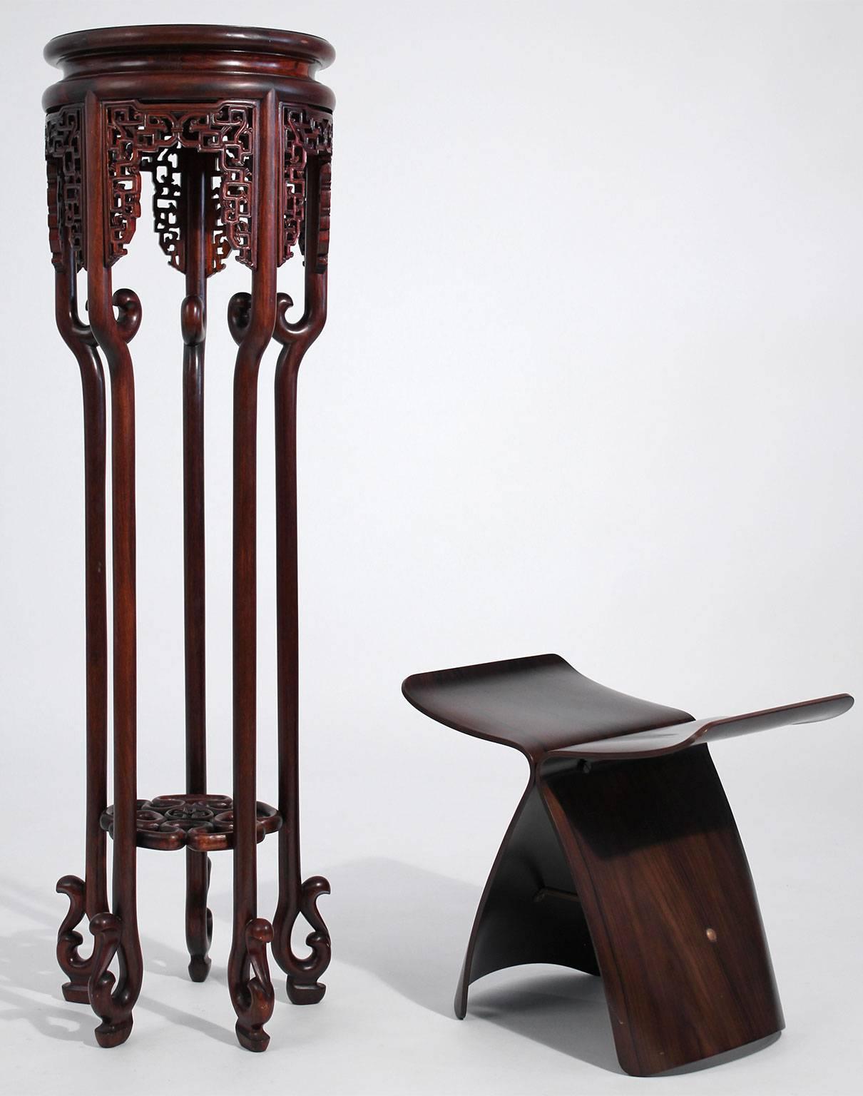 Antique Chinese carved rosewood floor plant stand. Heavily hand-carved and measures 43 3/4