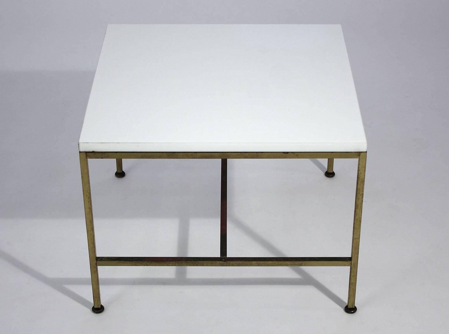 Paul McCobb for Calvin Furniture brass side table with original white Vitrolite glass. Table has all the original feet and the brass has a wonderful patina from age. Can be polished if desired. The top Vitrolite glass is in excellent shape with no