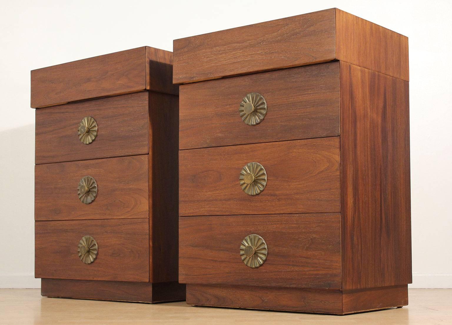 Beautiful pair of tall Modernist walnut end tables or nightstands, circa 1950. Great brass flower shaped hardware. Wonderful restored condition and hand oiled to bring out the beauty of the natural wood. Brass hardware has the original patina. Great