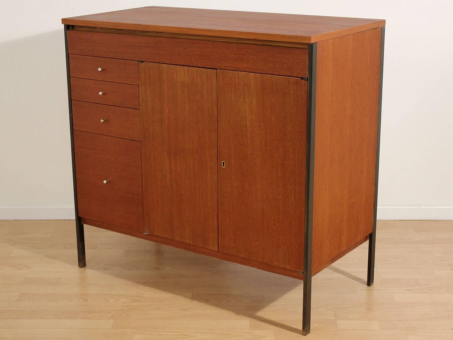 Seldom seen Paul McCobb designed bar/credenza for Calvin Furniture, circa 1950s. Legs are made of brass and have a wonderful patina. Mahogany wood has been refinished and hand oiled to bring out the beauty of the wood. Has the original key to lock