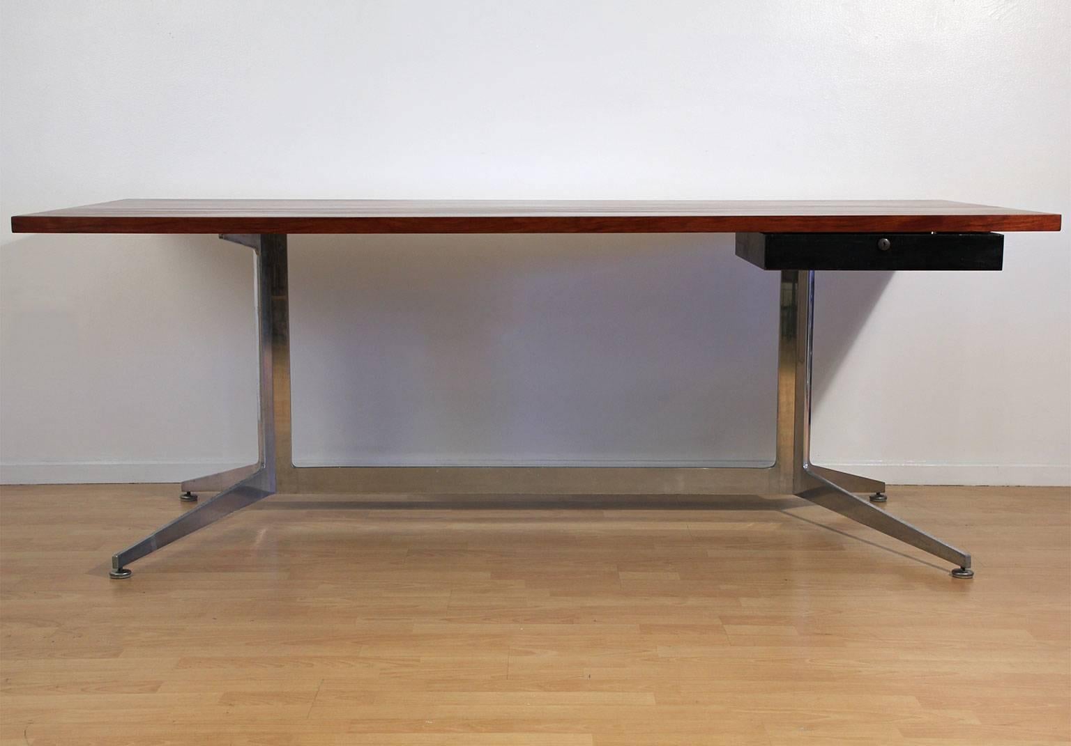 Beautiful rosewood and aluminum desk designed by Ward Bennett for Lehigh Furniture, circa 1960s. Amazing form and design. Rosewood has great color and grain. Top has been refinished and hand oiled to bring out the original beauty of the rosewood