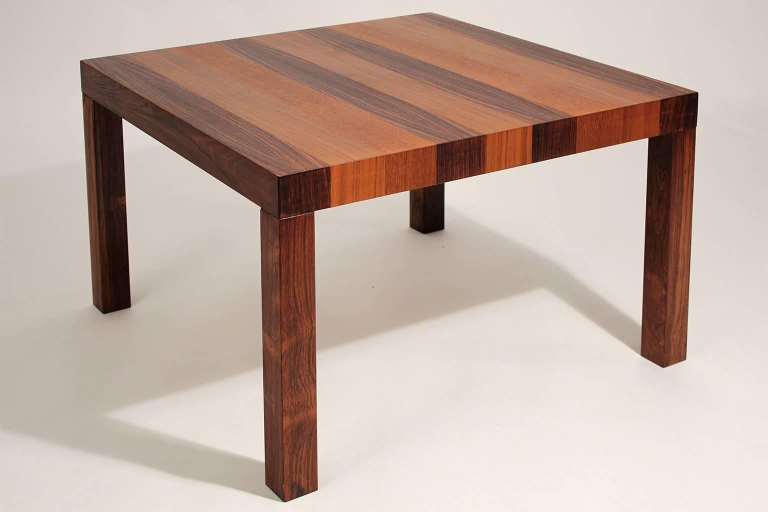 Beautiful Drylund of Denmark parquetry wood square form large table, circa 1970s. The top consists of several different exotic woods that include teak, rosewood, palissander and other woods. Has been hand oiled and is in excellent restored